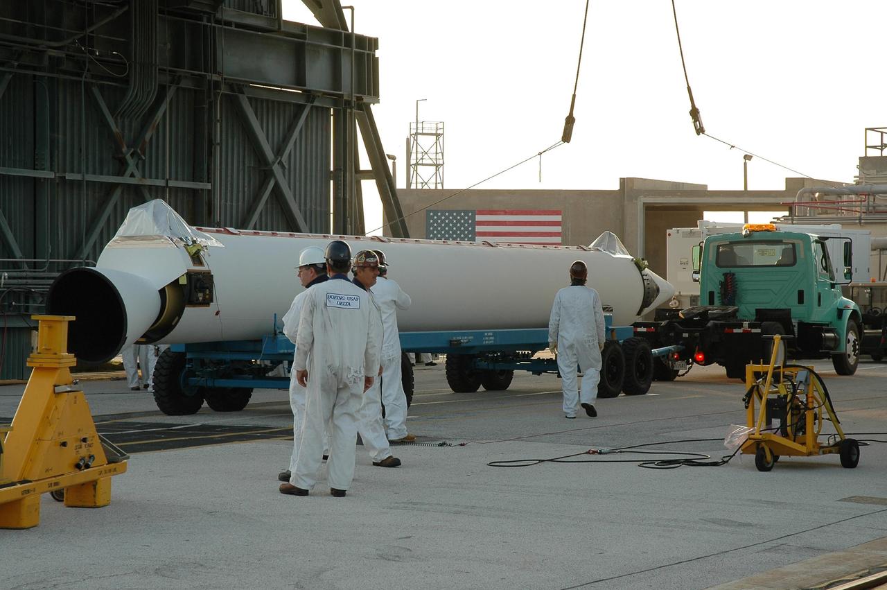 KENNEDY SPACE CENTER, FLA. -- Another solid rocket booster arrives on Launch Pad 17-B at Cape Canaveral Air Force Station to be mated to the Delta II first stage.  The Delta is the launch vehicle for the Dawn spacecraft.  Dawn's goal is to characterize the conditions and processes of the solar system's earliest epoch 4.5 billion years ago by investigating in detail two of the largest asteroids, Ceres and Vesta. They reside between Mars and Jupiter in the asteroid belt.  Launch is targeted for July 7.  Photo credit: NASA/Jim Grossmann