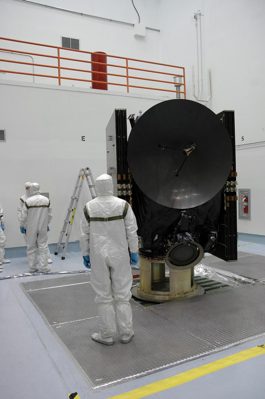 KENNEDY SPACE CENTER, FLA. -- Technicians at Astrotech are preparing the Dawn spacecraft for spin-balance testing. After the test, Dawn will then be mated to the upper stage booster, installed into a spacecraft transportation canister for the trip to Cape Canaveral Air Force Station and mated to the Delta II rocket at Launch Pad 17-B. The Dawn spacecraft will employ ion propulsion to explore two of the asteroid belt's most intriguing and dissimilar occupants: asteroid Vesta and the dwarf planet Ceres. Dawn's goal is to characterize the conditions and processes of the solar system's earliest epoch by investigating in detail these largest protoplanets that have remained intact since their formations. Ceres and Vesta reside in the extensive zone between Mars and Jupiter together with many other smaller bodies, called the asteroid belt. Dawn is scheduled to launch July 7. Photo credit: NASA/Jack Pfaller