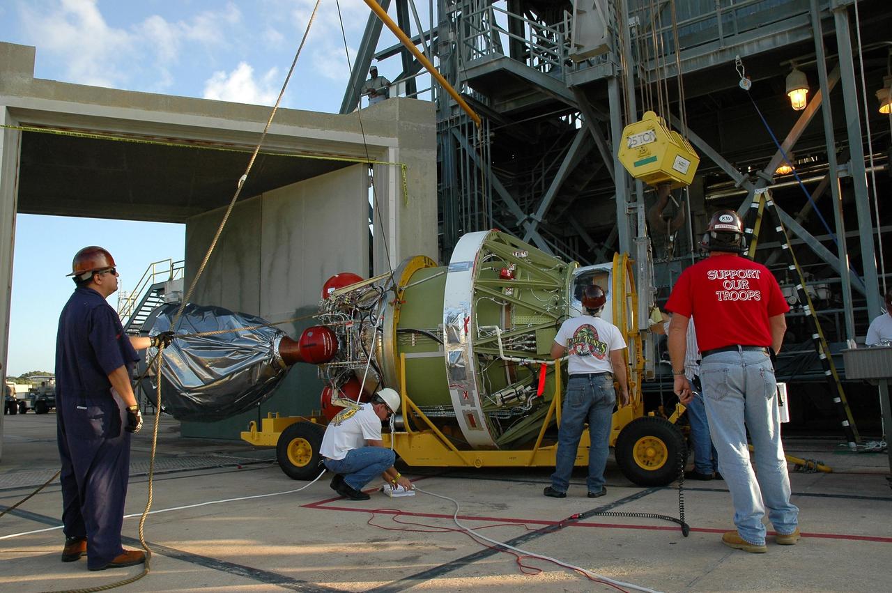 KENNEDY SPACE CENTER, FLA. --   The second stage of the Delta II launch vehicle for the Dawn spacecraft arrives on Launch Pad 17-B at Cape Canaveral Air Force Station where it will be mated with the first stage. The Delta II-Heavy, manufactured by the United Launch Alliance, is scheduled to launch the Dawn spacecraft on its 4-year flight to the asteroid belt.  The Delta II-Heavy is the strongest rocket in the Delta II class. It will use three stages and nine solid-fueled booster rockets to propel Dawn on its way. A 9.5-foot payload fairing will protect the spacecraft from the heat and stresses of launch. Dawn's goal is to characterize the conditions and processes of the solar system's earliest epoch by investigating in detail the largest protoplanets that have remained intact since their formations: asteroid Vesta and the dwarf planet Ceres.  They reside in the extensive zone between Mars and Jupiter together with many other smaller bodies, called the asteroid belt.  Dawn is scheduled to launch July 7.  Photo credit: NASA/Jack Pfaller