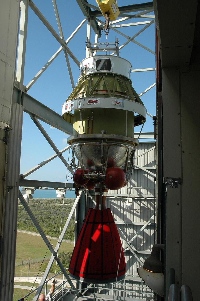 KENNEDY SPACE CENTER, FLA. --  On Launch Pad 17-B at Cape Canaveral Air Force Station, the second stage of the Delta II launch vehicle for the Dawn spacecraft arrives at the upper level of the mobile service tower.  It will be moved inside the tower and mated with the first stage already in the tower. The Delta II-Heavy, manufactured by the United Launch Alliance, is scheduled to launch the Dawn spacecraft on its 4-year flight to the asteroid belt.  The Delta II-Heavy is the strongest rocket in the Delta II class. It will use three stages and nine solid-fueled booster rockets to propel Dawn on its way. A 9.5-foot payload fairing will protect the spacecraft from the heat and stresses of launch. Dawn's goal is to characterize the conditions and processes of the solar system's earliest epoch by investigating in detail the largest protoplanets that have remained intact since their formations: asteroid Vesta and the dwarf planet Ceres.  They reside in the extensive zone between Mars and Jupiter together with many other smaller bodies, called the asteroid belt.  Dawn is scheduled to launch July 7.  Photo credit: NASA/Jack Pfaller