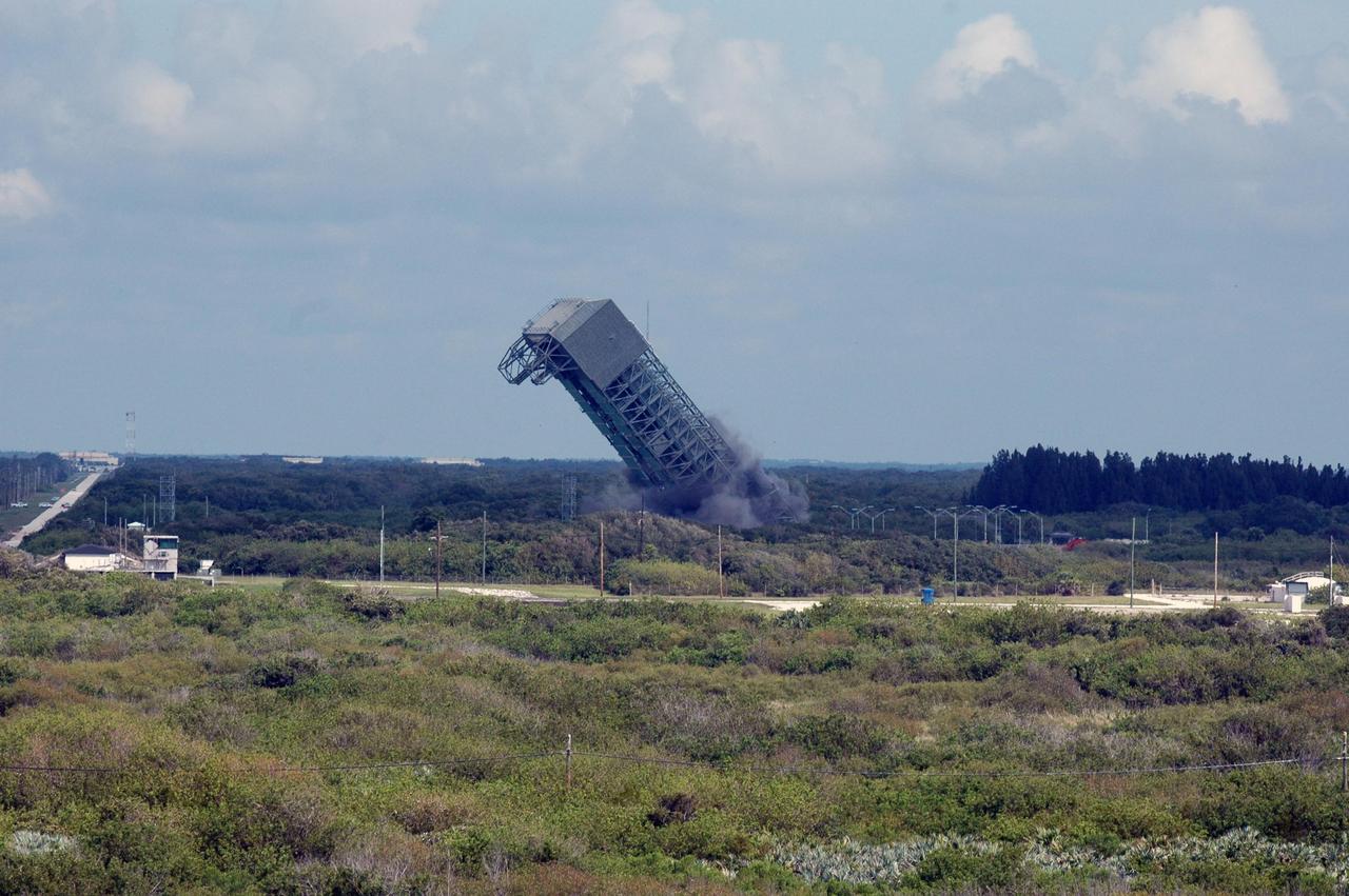 KENNEDY SPACE CENTER, FLA. --  At Space Launch Complex 36 on Cape Canaveral Air Force Station, the 209-foot-tall mobile service tower on Pad 36-B crashes to the ground.  It is one of two that were identified for demolition.  The old towers are being toppled as part of the ongoing project to demolish the historic site to prevent corrosion from becoming a safety concern.   A majority of the steel will be recycled and the rest will be taken to the landfill at CCAFS.  Complex 36 was the birthplace of NASA's planetary launch program.  It was built for the Atlas/Centaur development program and was operated under NASA's sponsorship until the late 1980s. Complex 36 hosted many historic missions over the years including Surveyor that landed on the moon and Mariner that orbited Mars and included one to Mercury.  Two of the most historic launches were the Pioneer 10 and 11 space probes that were launched to Jupiter and are now outside of the solar system in interstellar space.  Also, the historic Pioneer Venus spacecraft included an orbiter and a set of probes that were dispatched to the surface.  While Launch Complex 36 is gone, the Atlas/Centaur rocket continues to be launched as the Atlas V from Complex 41. Photo credit: NASA/Charisse Nahser