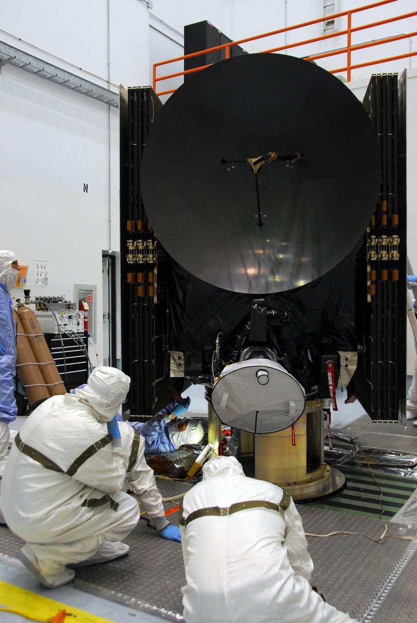 KENNEDY SPACE CENTER, FLA. --At Astrotech, engineers from Dutch Space are making repairs on the slight damage done by a technician's tool to the back of a solar array panel of the Dawn spacecraft on June 11 during a procedure to prepare Dawn for spin-balance testing. The size of the affected area is about 2.5 inches by 2 inches. There is no impact to the launch date of July 7. Dawn's goal is to characterize the conditions and processes of the solar system's earliest epoch 4.5 billion years ago by investigating in detail two of the largest asteroids, Ceres and Vesta. They reside between Mars and Jupiter in the asteroid belt. Photo credit: NASA/George Shelton