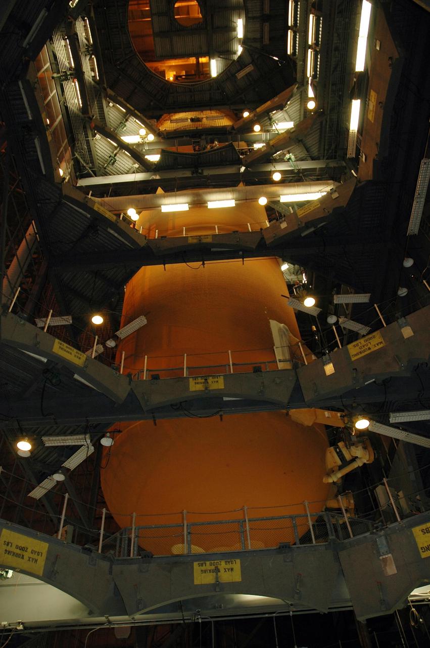 KENNEDY SPACE CENTER, FLA. --   The external tank for Endeavour is being lifted from the checkout cell inside the Vehicle Assembly Building for mating with the solid rocket boosters.  Endeavour is currently  targeted for rollover to the VAB July 5.  Endeavour is the designated orbiter for mission STS-118, targeted for launch on Aug. 9 to the International Space Station. The mission will continue space station construction by delivering a third starboard truss segment, S5, as well as carrying the external stowage platform 3.  Photo credit: NASA/Amanda Diller