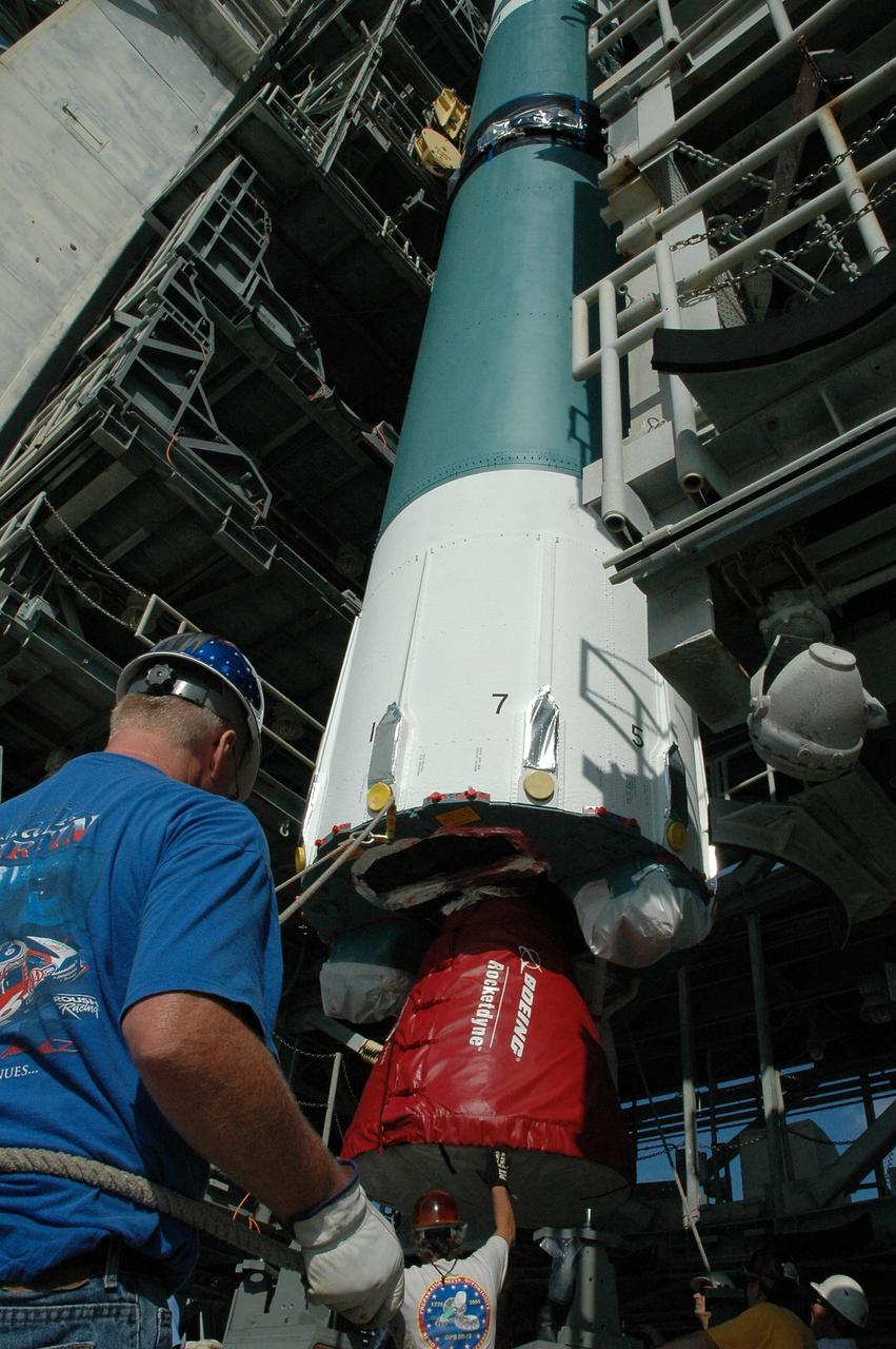 KENNEDY SPACE CENTER, FLA. -- On Launch Pad 17-A at Cape Canaveral Air Force Station, the first stage of a Delta II rocket is ready for lifting up into the mobile service tower. The rocket is the launch vehicle for the Phoenix spacecraft, targeted for launch on Aug. 3 heading for Mars. Phoenix will land in icy soils near the north polar permanent ice cap of Mars and explore the history of the water in these soils and any associated rocks, while monitoring polar climate. Landing on Mars is planned in May 2008 on arctic ground where a mission currently in orbit, Mars Odyssey, has detected high concentrations of ice just beneath the top layer of soil. Photo credit: NASA/Amanda Diller