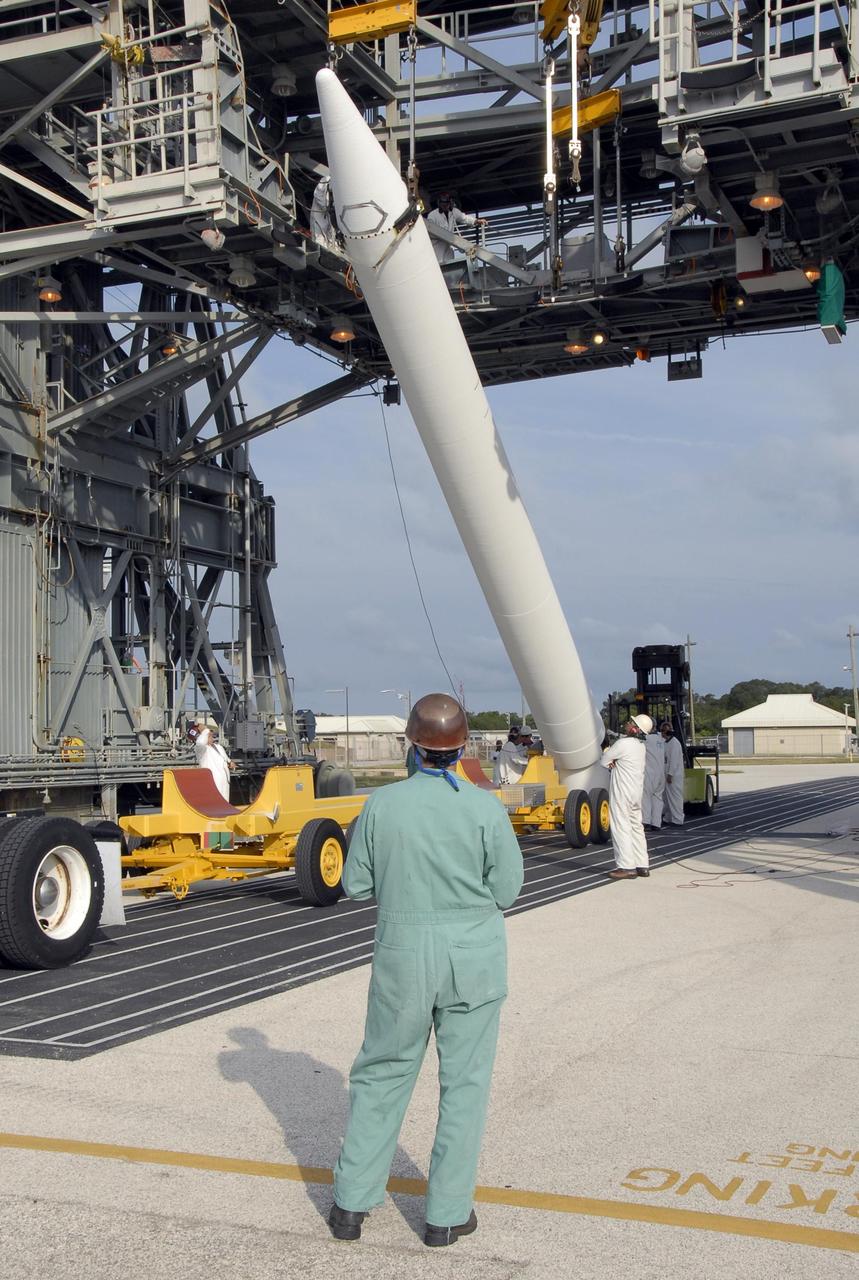 KENNEDY SPACE CENTER, FLA. -- On Pad 17-A at Cape Canaveral Air Force Station, the solid rocket booster is raised off its transporter. The SRB will be lifted into the mobile service tower for mating with the Delta II first stage. The Delta is the launch vehicle for the Phoenix Mars Lander spacecraft. Phoenix will land in icy soils near the north polar permanent ice cap of Mars and explore the history of the water in these soils and any associated rocks, while monitoring polar climate. Landing on Mars is planned in May 2008 on arctic ground where a mission currently in orbit, Mars Odyssey, has detected high concentrations of ice just beneath the top layer of soil. Phoenix is scheduled to launch Aug. 3. Photo credit: NASA/Kim Shiflett