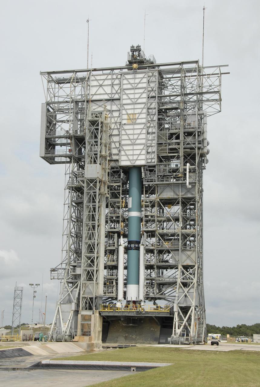KENNEDY SPACE CENTER, FLA. -- On Pad 17-A at Cape Canaveral Air Force Station, three solid rocket boosters and the Delta II first stage are ready for mating inside the mobile service tower. The Delta is the launch vehicle for the Phoenix Mars Lander spacecraft. Phoenix will land in icy soils near the north polar permanent ice cap of Mars and explore the history of the water in these soils and any associated rocks, while monitoring polar climate. Landing on Mars is planned in May 2008 on arctic ground where a mission currently in orbit, Mars Odyssey, has detected high concentrations of ice just beneath the top layer of soil. Phoenix is scheduled to launch Aug. 3. Photo credit: NASA/Kim Shiflett