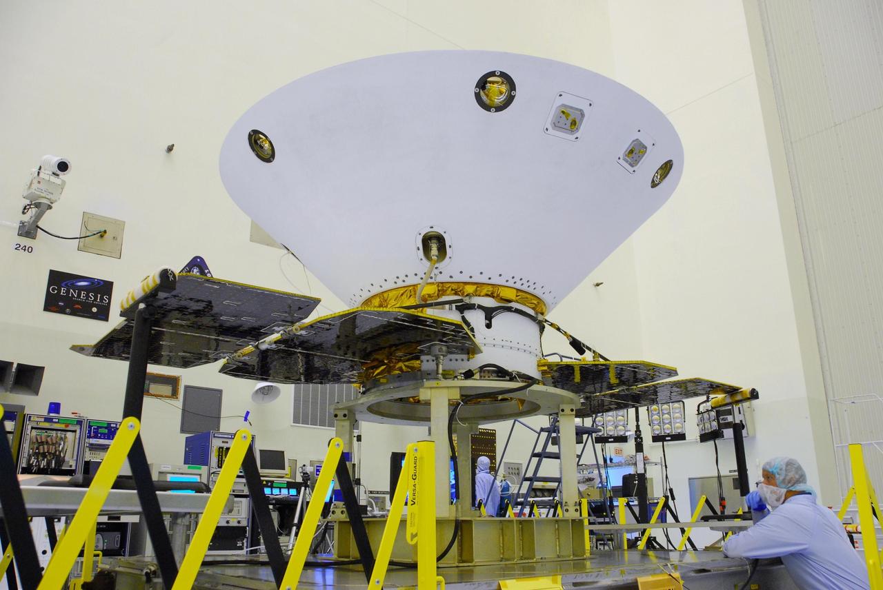 KENNEDY SPACE CENTER, FLA. --  In the Payload Hazardous Servicing Facility at Cape Canaveral Air Force Station, the solar array panels have been unfolded around the Phoenix Mars Lander spacecraft. The deployment of the panels is part of the pre-launch testing under way.  Phoenix will land in icy soils near the north polar permanent ice cap of Mars and explore the history of the water in these soils and any associated rocks, while monitoring polar climate. Landing on Mars is planned in May 2008 on arctic ground where a mission currently in orbit, Mars Odyssey, has detected high concentrations of ice just beneath the top layer of soil.  Phoenix is scheduled to launch Aug. 3.  Photo credit: NASA/George Shelton