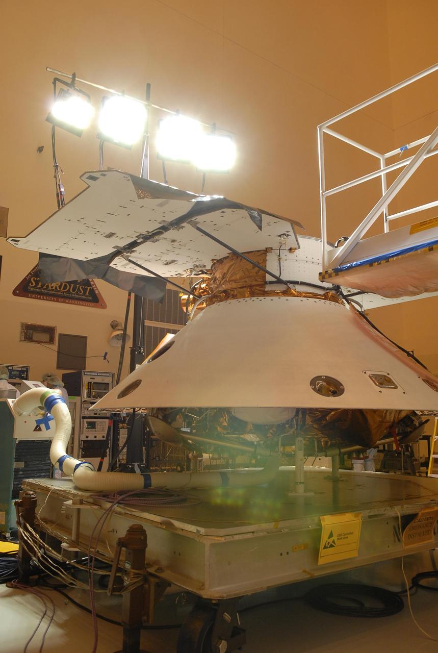KENNEDY SPACE CENTER, FLA. -- In the Payload Hazardous Servicing Facility, the Phoenix Mars Lander spacecraft undergoes illumination testing of its solar array panels. The Phoenix will be launched toward Mars to land in icy soils near the planet's north polar permanent ice cap. It will explore the history of the water in these soils and any associated rocks, while monitoring polar climate. Landing on Mars is planned in May 2008 on arctic ground where a mission currently in orbit, Mars Odyssey, has detected high concentrations of ice just beneath the top layer of soil. Phoenix is scheduled to launch Aug. 3 from Pad 17-A at Cape Canaveral Air Force Station . Photo credit: NASA/Kim Shiflett