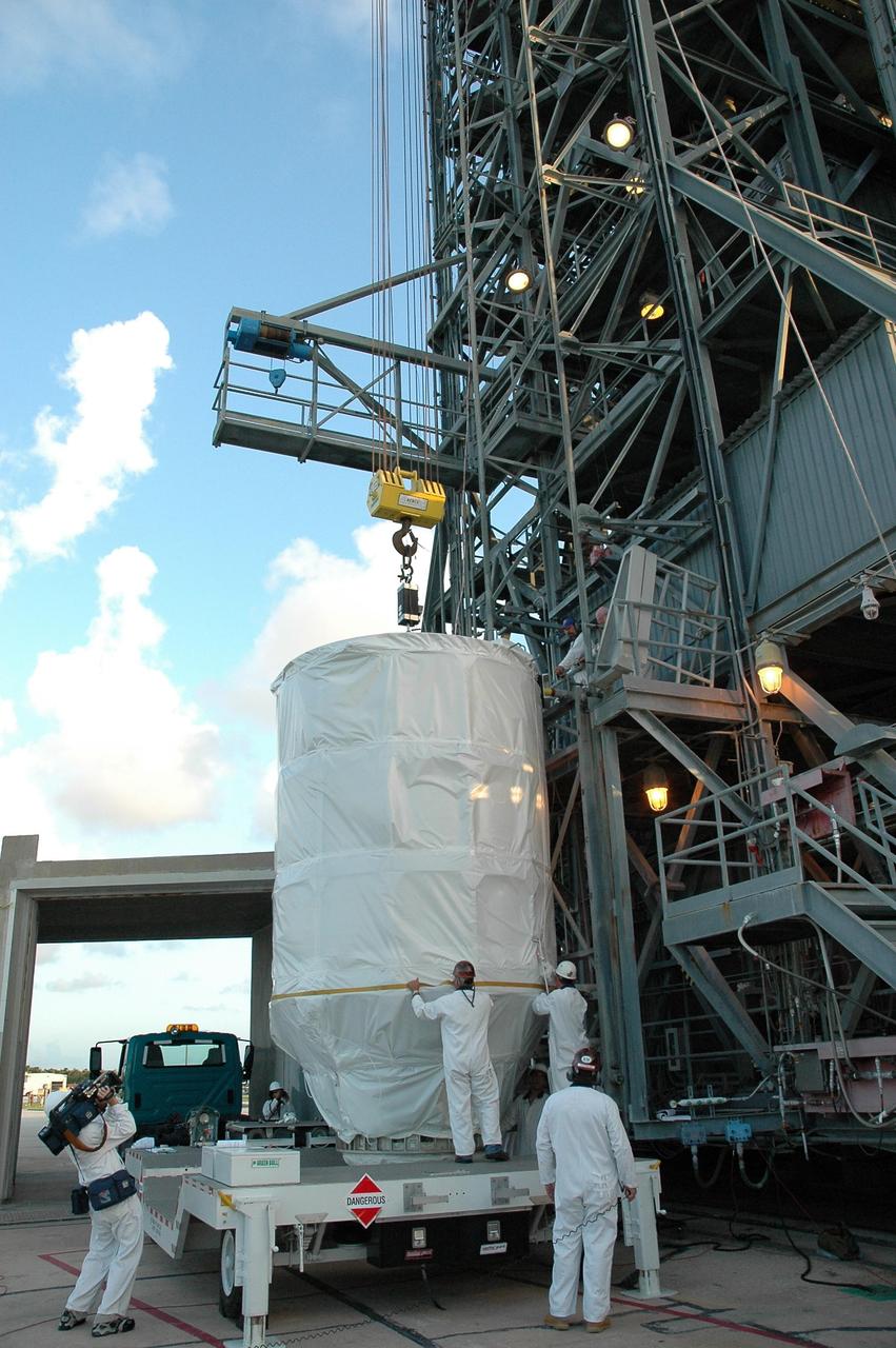 KENNEDY SPACE CENTER, FLA. --  At Launch Pad 17-B, at Cape Canaveral Air Force Station, workers prepare NASA's Dawn spacecraft mated to the Delta II upper stage booster, for hoisting up into the mobile service tower.  Dawn will be mated with the Delta II launch vehicle.   Dawn is the ninth mission in NASA's Discovery Program. The spacecraft will be the first to orbit two planetary bodies, asteroid Vesta and dwarf planet Ceres,  during a single mission. Vesta and Ceres lie in the asteroid belt between Mars and Jupiter. It is also NASA's first purely scientific mission powered by three solar electric ion propulsion engines. Photo credit: NASA/Troy Cryder.
