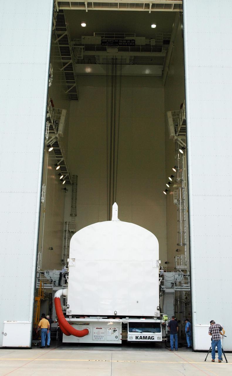 KENNEDY SPACE CENTER, FLA. --  The STS-118 payload canister transporter moves into the Canister Rotation Facility.  Inside the canister are the SPACEHAB module, the S5 truss and the external stowage platform 3.  At the CRF, the canister will be raised to a vertical position for delivery to Launch Pad 39A.  Endeavour is targeted for launch on Aug. 9 to the International Space Station. The mission will continue space station construction with installation of the truss.  Photo credit: NASA/Jim Grossmann
