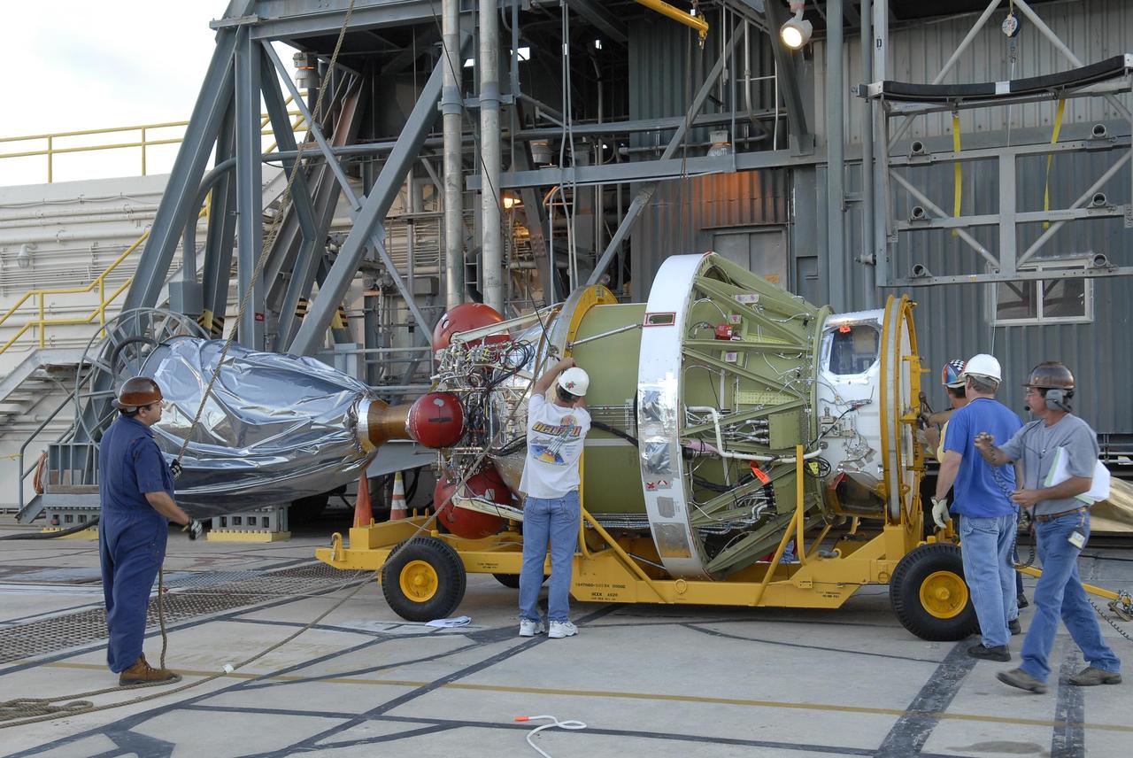 KENNEDY SPACE CENTER, FLA. -- The second stage of the Delta II launch vehicle for NASA's Phoenix Mars Lander arrives on Launch Pad 17-A at Cape Canaveral Air Force Station. The second stage will be lifted into the mobile service tower and mated with the Delta's first stage. The second stage will be lifted into the mobile service tower and mated with the first stage. Phoenix is scheduled to launch Aug. 3. Phoenix will land in icy soils near the north polar permanent ice cap of Mars and explore the history of the water in these soils and any associated rocks, while monitoring polar climate. Landing on Mars is planned in May 2008 on arctic ground where a mission currently in orbit, Mars Odyssey, has detected high concentrations of ice just beneath the top layer of soil. Photo credit: NASA/Kim Shiflett