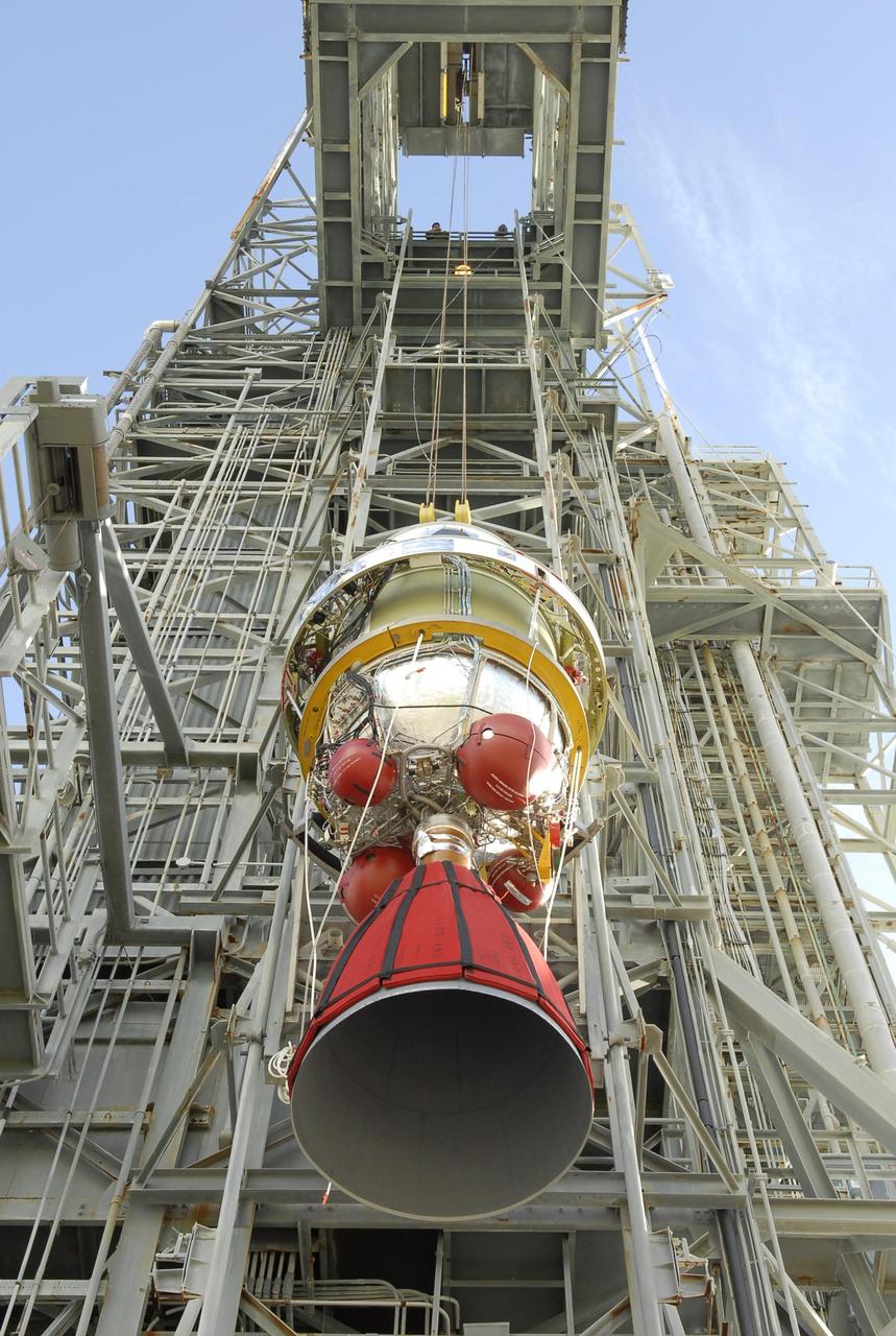 KENNEDY SPACE CENTER, FLA. -- Viewed from below, the second stage of the Delta II launch vehicle for NASA's Phoenix Mars Lander is lifted up the mobile service tower on Launch Pad 17-A at Cape Canaveral Air Force Station. The second stage will be moved into the tower and lowered for mating with the Delta's first stage. Phoenix is scheduled to launch Aug. 3. Phoenix will land in icy soils near the north polar permanent ice cap of Mars and explore the history of the water in these soils and any associated rocks, while monitoring polar climate. Landing on Mars is planned in May 2008 on arctic ground where a mission currently in orbit, Mars Odyssey, has detected high concentrations of ice just beneath the top layer of soil. Photo credit: NASA/Kim Shiflett