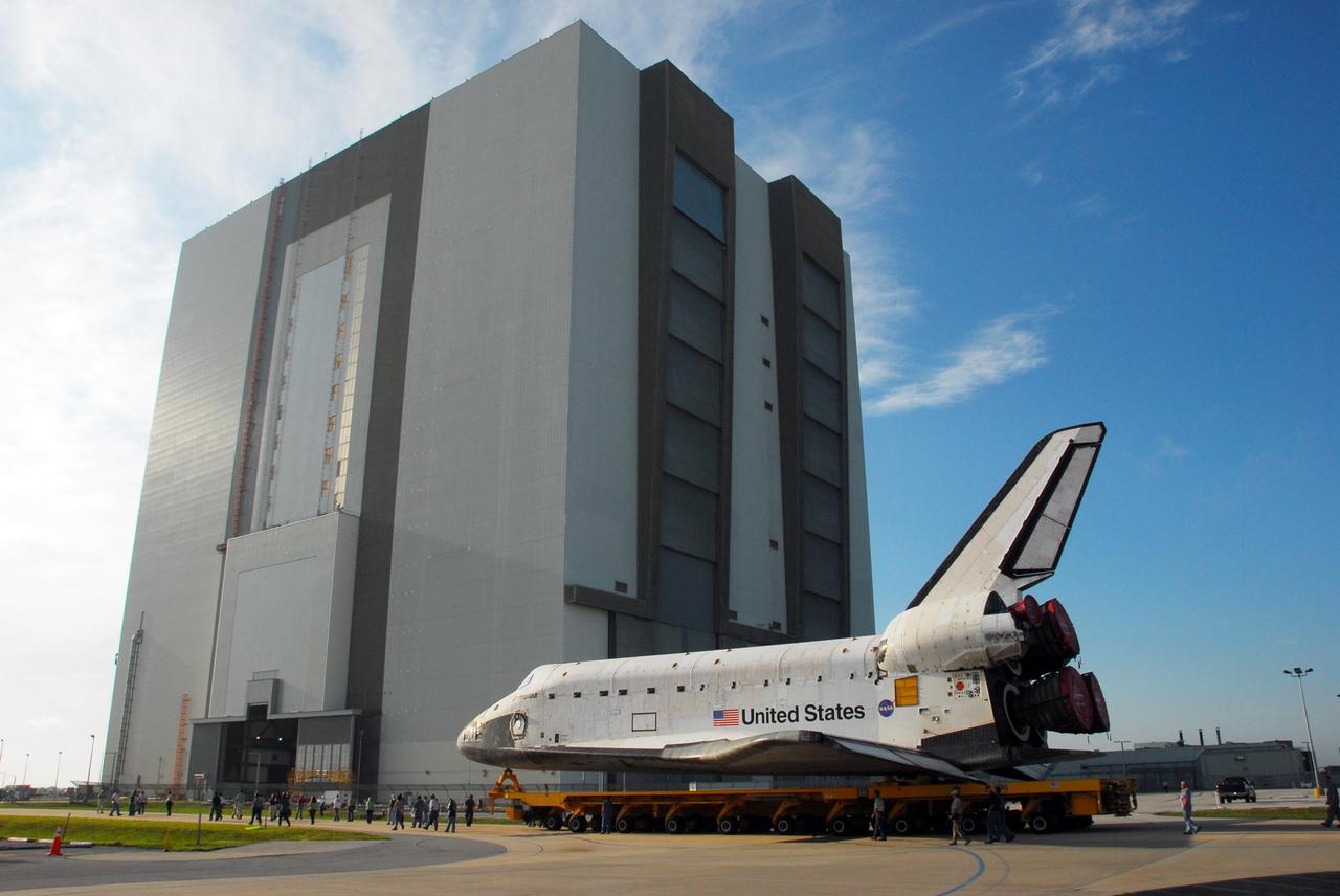 KENNEDY SPACE CENTER, FLA. -- After leaving the Orbiter Processing Facility bay 2, the orbiter Endeavour, atop its transporter, rolls to the Vehicle Assembly Building. In the VAB, it will be stacked with the external tank and solid rocket boosters atop the mobile launcher platform for its launch on mission STS-118. The mission will be Endeavour's first flight in more than four years. The shuttle has undergone extensive modifications, including the addition of safety upgrades already added to shuttles Discovery and Atlantis. Endeavour also features new hardware, such as the Station-to-Shuttle Power Transfer System that will allow the docked shuttle to draw electrical power from the station and extend its visits to the orbiting lab. Endeavour is targeted for launch on Aug. 7. Photo credit: NASA/George Shelton
