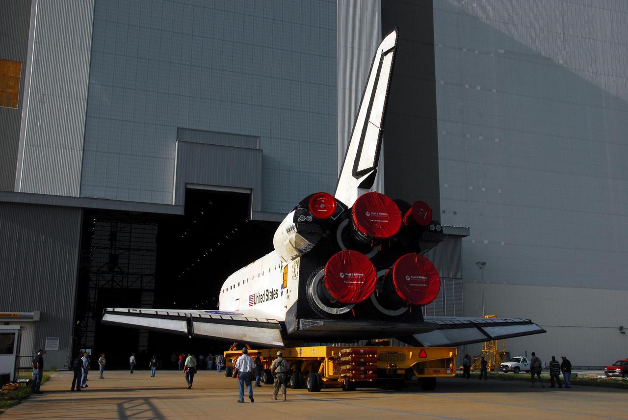 KENNEDY SPACE CENTER, FLA. -- The orbiter Endeavour, atop its transporter, rolls into the gaping doorway of the Vehicle Assembly Building. In the VAB, it will be stacked with the external tank and solid rocket boosters atop the mobile launcher platform for its launch on mission STS-118. The mission will be Endeavour's first flight in more than four years. The shuttle has undergone extensive modifications, including the addition of safety upgrades already added to shuttles Discovery and Atlantis. Endeavour also features new hardware, such as the Station-to-Shuttle Power Transfer System that will allow the docked shuttle to draw electrical power from the station and extend its visits to the orbiting lab. Endeavour is targeted for launch on Aug. 7. Photo credit: NASA/George Shelton