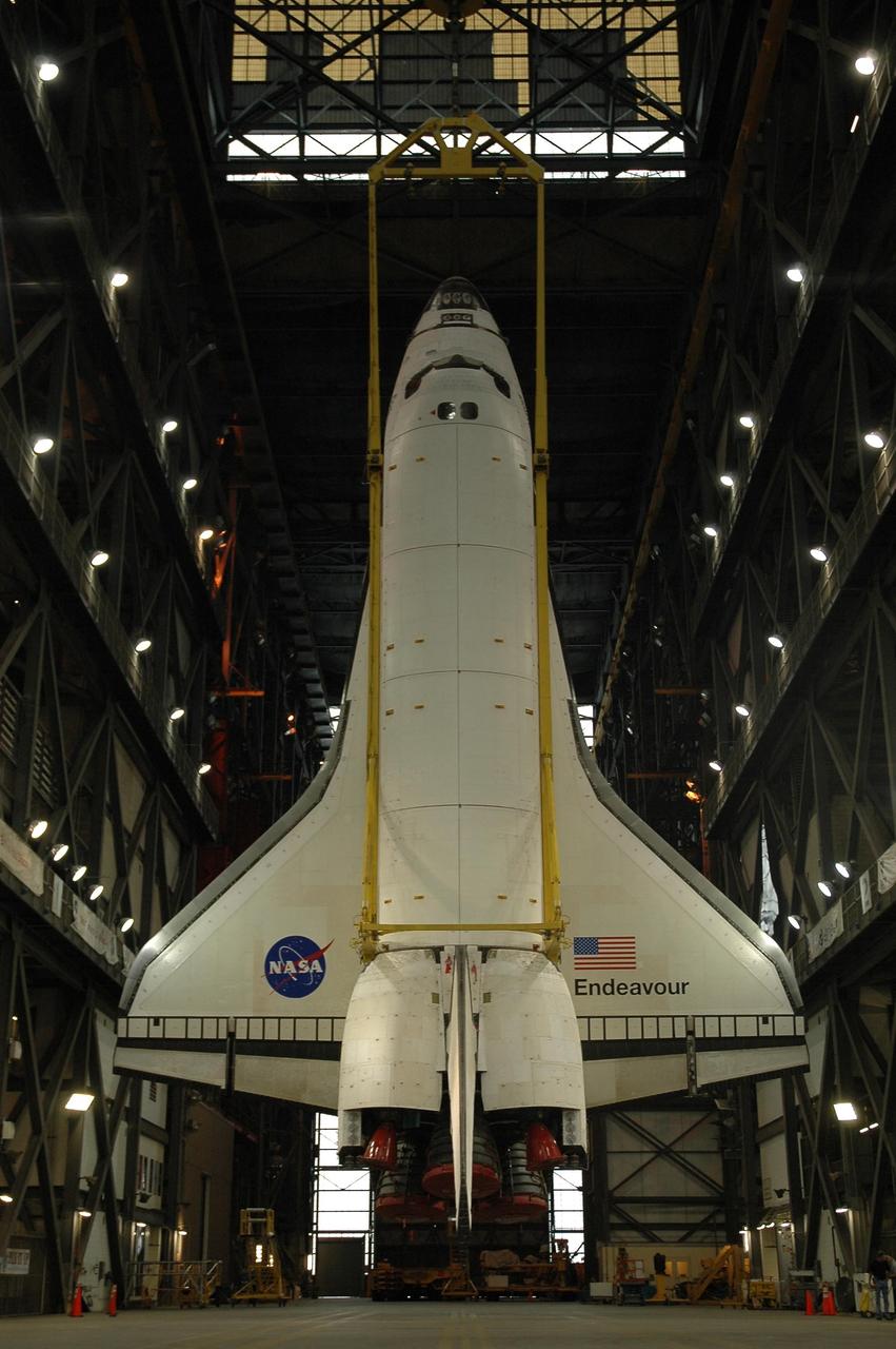 KENNEDY SPACE CENTER, FLA. --  The orbiter Endeavour hangs vertically above the transfer aisle of the Vehicle Assembly Building.  It will be lifted into the upper levels of the Vehicle Assembly Building , moved laterally over a crossbeam to high bay 1 and stacked with the external tank and solid rocket boosters on the mobile launcher platform.  Endeavour will be launched on mission STS-118, its first flight in more than four years. The shuttle has undergone extensive modifications, including the addition of safety upgrades already added to shuttles Discovery and Atlantis. Endeavour also features new hardware, such as the Station-to-Shuttle Power Transfer System that will allow the docked shuttle to draw electrical power from the station and extend its visits to the orbiting lab.  Endeavour is targeted for launch on Aug. 7.     Photo credit: NASA/Troy Cryder
