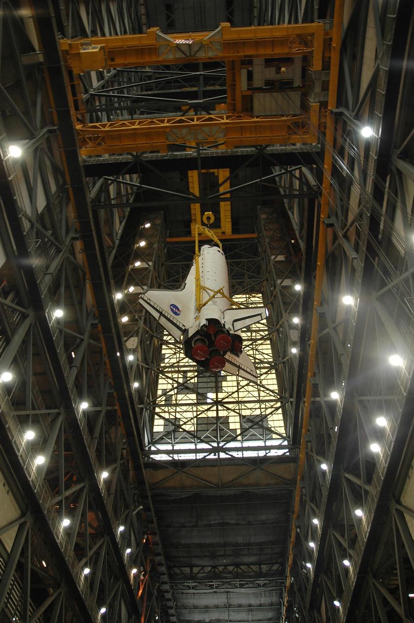 KENNEDY SPACE CENTER, FLA. --  The orbiter Endeavour is lifted into the upper levels of the Vehicle Assembly Building.  It will be moved laterally over a crossbeam and lowered into high bay 1 for stacking with the external tank and solid rocket boosters on the mobile launcher platform.  Endeavour will be launched on mission STS-118, its first flight in more than four years. The shuttle has undergone extensive modifications, including the addition of safety upgrades already added to shuttles Discovery and Atlantis. Endeavour also features new hardware, such as the Station-to-Shuttle Power Transfer System that will allow the docked shuttle to draw electrical power from the station and extend its visits to the orbiting lab.  Endeavour is targeted for launch on Aug. 7.     Photo credit: NASA/Troy Cryder