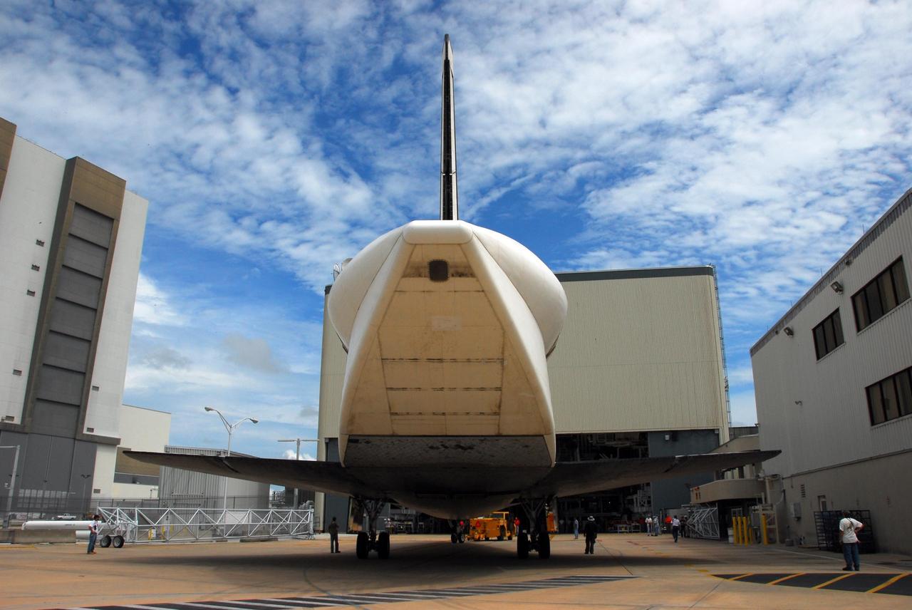 KENNEDY SPACE CENTER, FLA. -- Atlantis arrives at the Orbiter Processing Facility from the Shuttle Landing Facility at Kennedy Space Center. The orbiter will undergo processing for its next launch, mission STS-122 in December. Visible on Atlantis is the tail cone that covers and protects the main engines during the ferry flight. Atlantis arrived at Kennedy Space Center atop the SCA on July 3 after a three-day, cross-country flight due to fuel stops and weather delays. Touchdown was at 8:27 a.m. EDT. Atlantis landed at Edwards Air Force Base in California on June 22 to end mission STS-117. Photo credit: NASA/George Shelton.