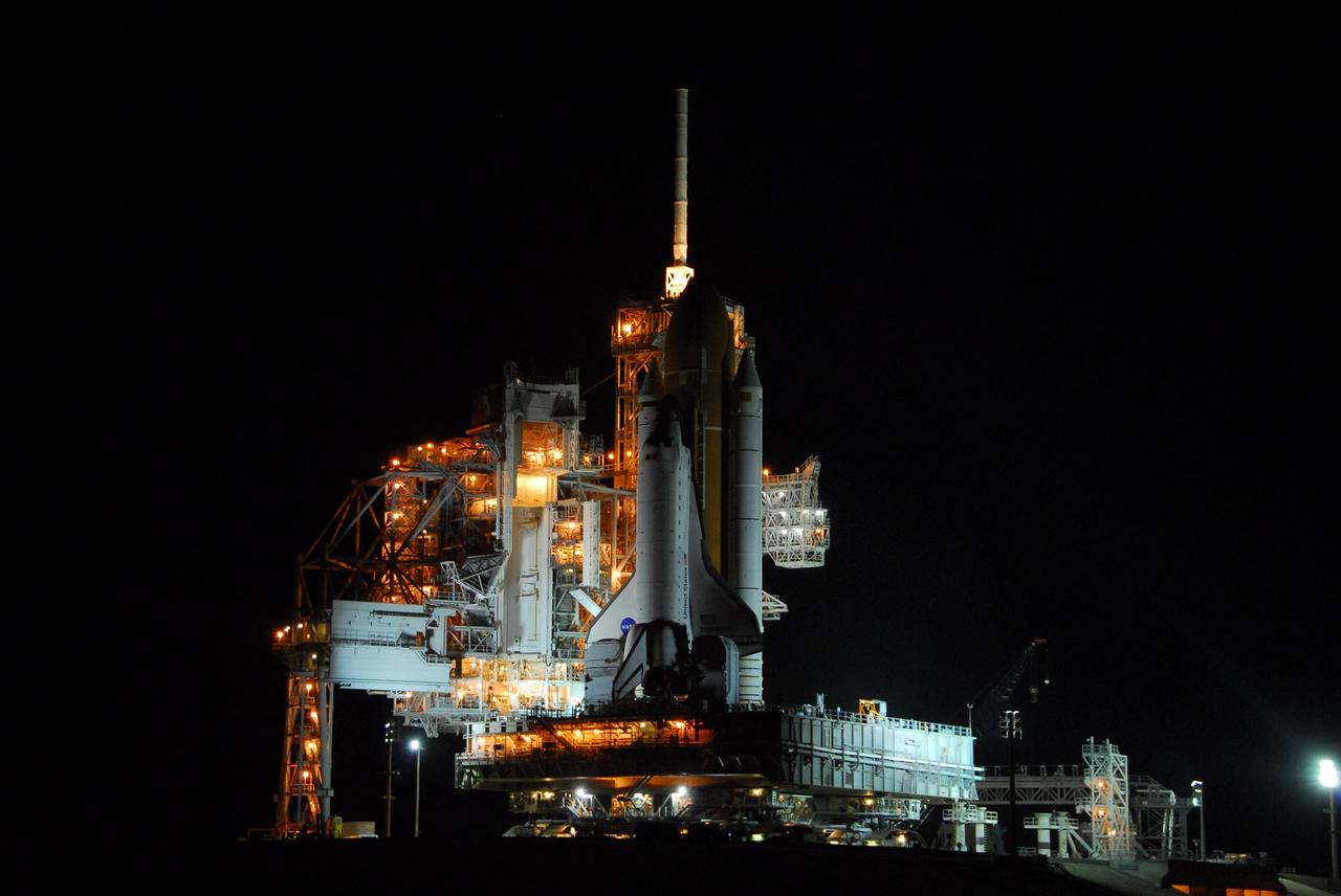 KENNEDY SPACE CENTER, FLA. -- After a nearly 7-hour trip, Space Shuttle Endeavour, sitting atop the mobile launcher platform, arrives on Launch Pad 39A after rolling out of the Vehicle Assembly Building. First motion was at 8:10 p.m. July 10 and the shuttle was hard down on the pad at 3:02 a.m. July 11. Endeavour is scheduled to launch on mission STS-118 on Aug. 7. During the mission, Endeavour will carry into orbit the S5 truss, SPACEHAB module and external stowage platform 3. The mission is the 22nd flight to the International Space Station and will mark the first flight of Mission Specialist Barbara Morgan, the teacher-turned-astronaut whose association with NASA began more than 20 years ago. STS-118 will be the first flight since 2002 for Endeavour, which has undergone extensive modifications, including the addition of safety upgrades already added to orbiters Discovery and Atlantis. Photo credit: NASA/George Shelton