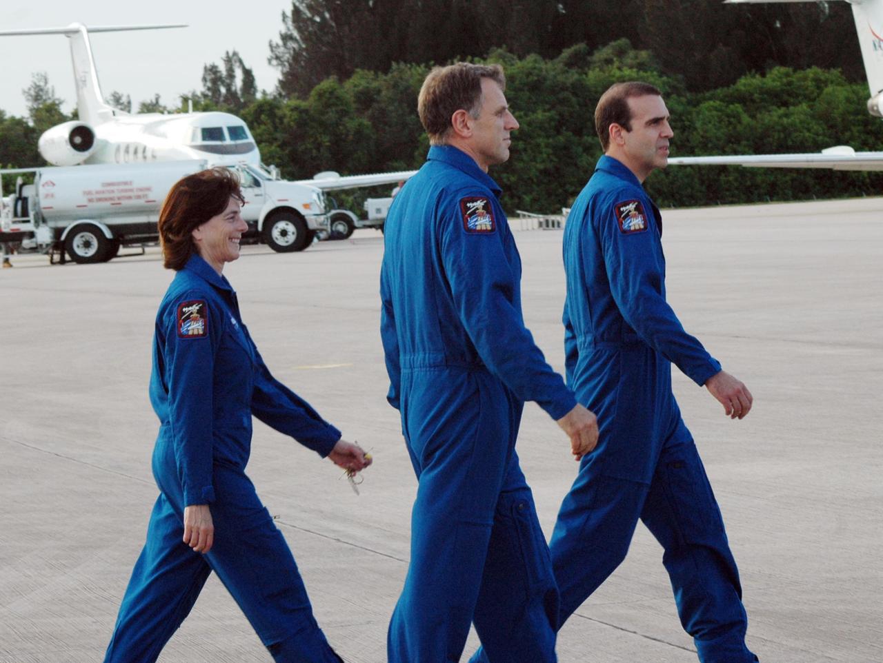 KENNEDY SPACE CENTER, Fla.  -- The STS-118 crew arrives at Kennedy's Shuttle Landing Facility aboard a Shuttle Training Aircraft to take part in the Terminal Countdown Demonstration Test (TCDT), a dress rehearsal for launch. From left are Mission Specialists Barbara R. Morgan, Dave Williams and Rick Mastracchio. Williams represents the Canadian Space Agency. Morgan joined NASA's Teacher in Space program in 1985 and was selected as an astronaut in 1998. TCDT activities include M-113 armored personnel carrier training, payload familiarization, emergency egress training at the pad and a simulated launch countdown. The STS-118 payload aboard Space Shuttle Endeavour includes the S5 truss, a SPACEHAB module and external stowage platform 3. The mission is the 22nd flight to the International Space Station and is targeted for launch on Aug.7. Photo credit: NASA/Ken Thornsley