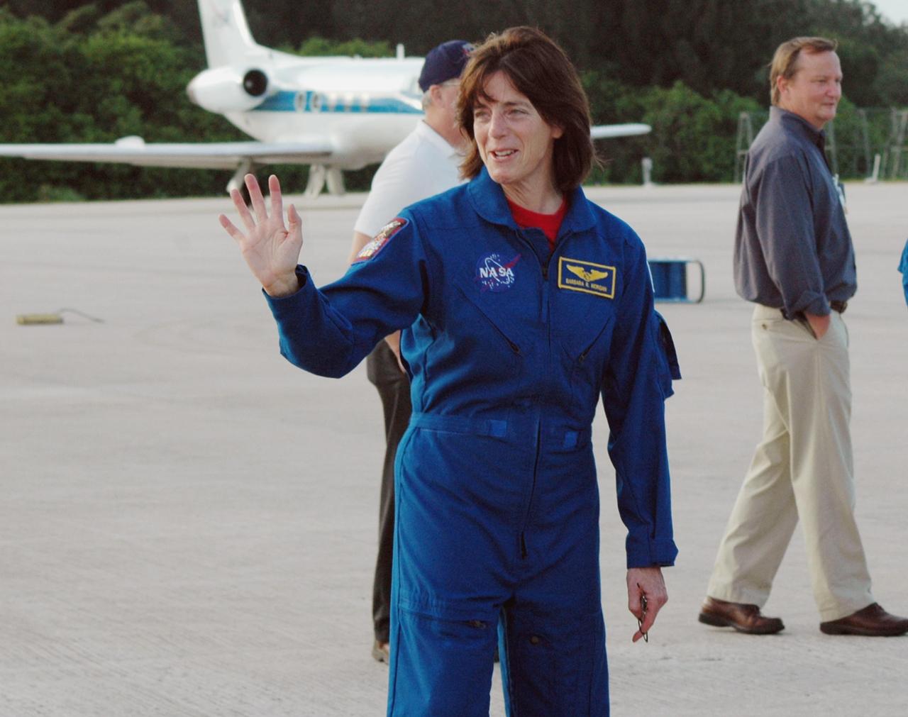 KENNEDY SPACE CENTER, Fla.  -- The STS-118 crew arrives at Kennedy's Shuttle Landing Facility aboard a Shuttle Training Aircraft to take part in the Terminal Countdown Demonstration Test (TCDT), a dress rehearsal for launch. Mission Specialist Barbara R. Morgan, NASA's first educator astronaut, acknowledges those who have turned out to welcome them. TCDT activities include M-113 armored personnel carrier training, payload familiarization, emergency egress training at the pad and a simulated launch countdown. The STS-118 payload aboard Space Shuttle Endeavour includes the S5 truss, a SPACEHAB module and external stowage platform 3. The mission is the 22nd flight to the International Space Station and is targeted for launch on Aug.7. Photo credit: NASA/Ken Thornsley