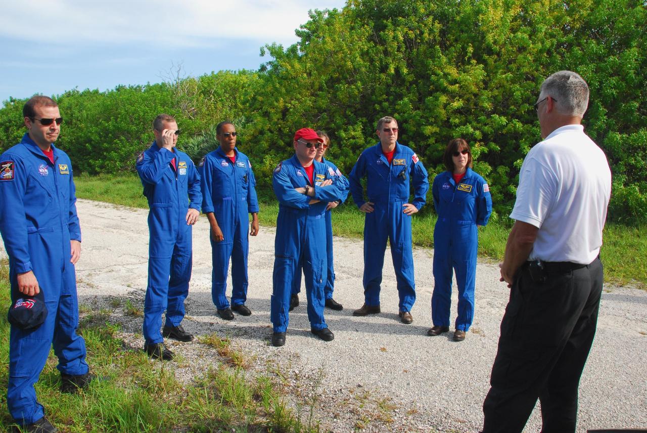 KENNEDY SPACE CENTER, Fla.  -- The STS-118 crew gets instructions on emergency exit procedures from Launch Pad 39A.  From left are Mission Specialist Rick Mastracchio, Pilot Charlie Hobaugh, Mission Specialist Alvin Drew, Commander Scott Kelly, and Mission Specialists Tracy Caldwell, Dave Williams and Barbara R. Morgan, whojoined NASA's Teacher in Space program in 1985. She was selected as an astronaut in 1998. TCDT activities include the M-113 training, payload familiarization, emergency egress training at the pad and a simulated launch countdown.  The STS-118 payload aboard Space Shuttle Endeavour includes the S5 truss, a SPACEHAB module and external stowage platform 3. The mission is the 22nd flight to the International Space Station and is targeted for launch on Aug.7.  NASA/George Shelton