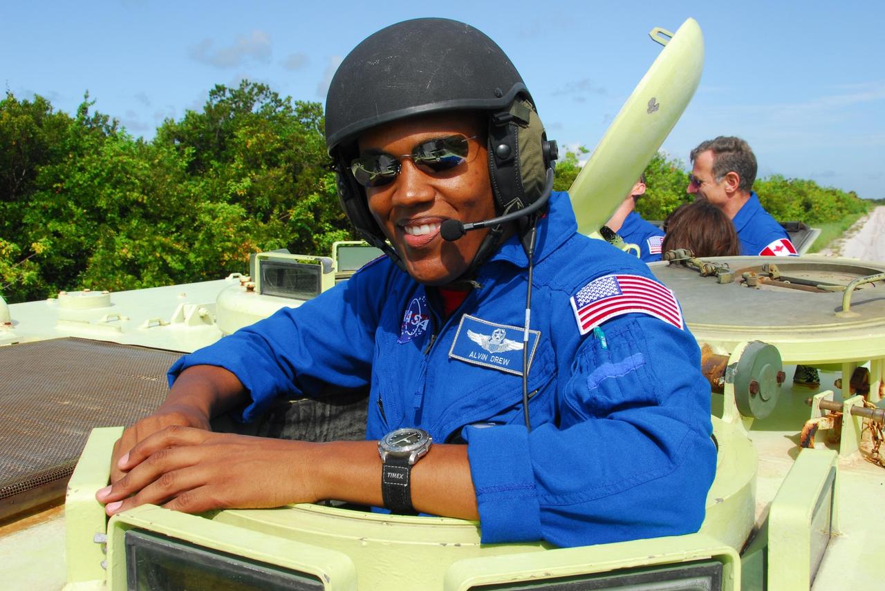 KENNEDY SPACE CENTER, Fla.  --  STS-118 Mission Specialist Alvin Drew stands inside an M-113 armored personnel carrier before his driving session, as part of emergency exit training.  He and other crew members are at Kennedy for the Terminal Countdown Demonstration Test (TCDT), a dress rehearsal for launch. TCDT activities include the M-113 training, payload familiarization, emergency egress training at the pad and a simulated launch countdown.  The STS-118 payload aboard Space Shuttle Endeavour includes the S5 truss, a SPACEHAB module and external stowage platform 3. The mission is the 22nd flight to the International Space Station and is targeted for launch on Aug.7.  NASA/George Shelton