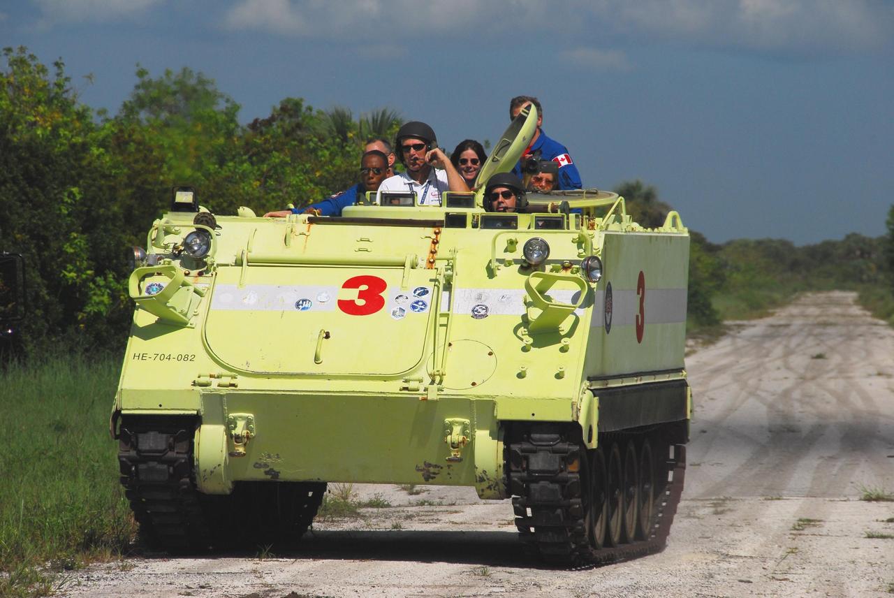 KENNEDY SPACE CENTER, Fla.  --  STS-118 Mission Specialist Rick Mastracchio practices driving an M-113 armored personnel carrier as part of emergency exit training.  The astronauts seen behind him are Mission Specialists Alvin Drew, Barbara R. Morgan, Dave Williams (standing) and Tracy Caldwell.  Morgan joined NASA's Teacher in Space program in 1985 and was selected as an astronaut in 1998.  Williams represents the Canadian Space Agency.  The crew is at Kennedy for the Terminal Countdown Demonstration Test (TCDT), a dress rehearsal for launch.  TCDT activities include the M-113 training, payload familiarization, emergency egress training at the pad and a simulated launch countdown.  The STS-118 payload aboard Space Shuttle Endeavour includes the S5 truss, a SPACEHAB module and external stowage platform 3. The mission is the 22nd flight to the International Space Station and is targeted for launch on Aug.7.  NASA/George Shelton