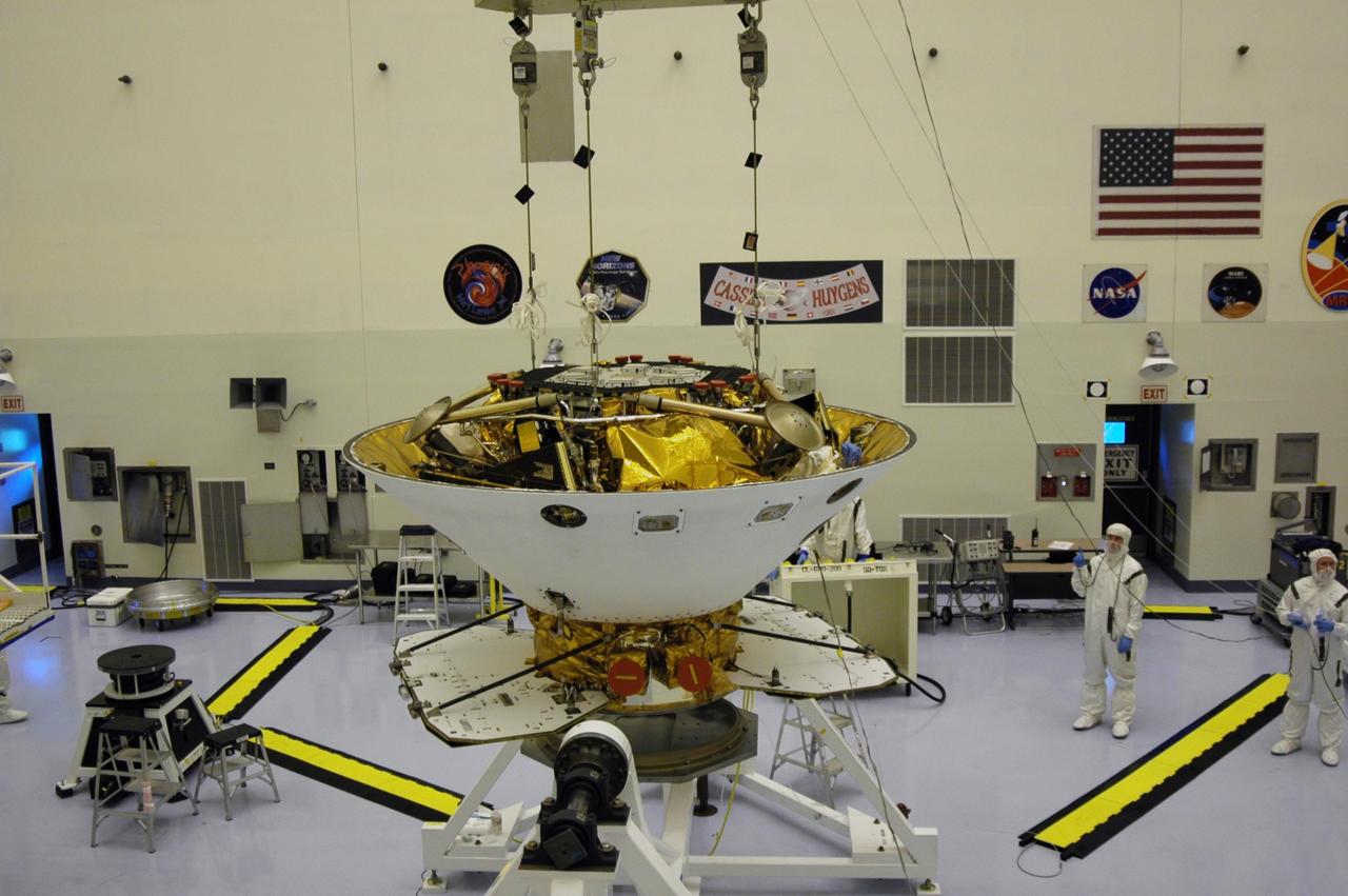 KENNEDY SPACE CENTER, Fla. -- In the Payload Hazardous Servicing Facility, the Phoenix Mars Lander spacecraft is lifted from its stand. The Phoenix will be moved to the upper stage booster for mating. Targeted for launch from Cape Canaveral Air Force Station on Aug. 3, Phoenix will land in icy soils near the north polar permanent ice cap of Mars and explore the history of the water in these soils and any associated rocks, while monitoring polar climate. Landing on Mars is planned in May 2008 on arctic ground where a mission currently in orbit, Mars Odyssey, has detected high concentrations of ice just beneath the top layer of soil. Photo credit: NASA/Dimitri Gerondidakis