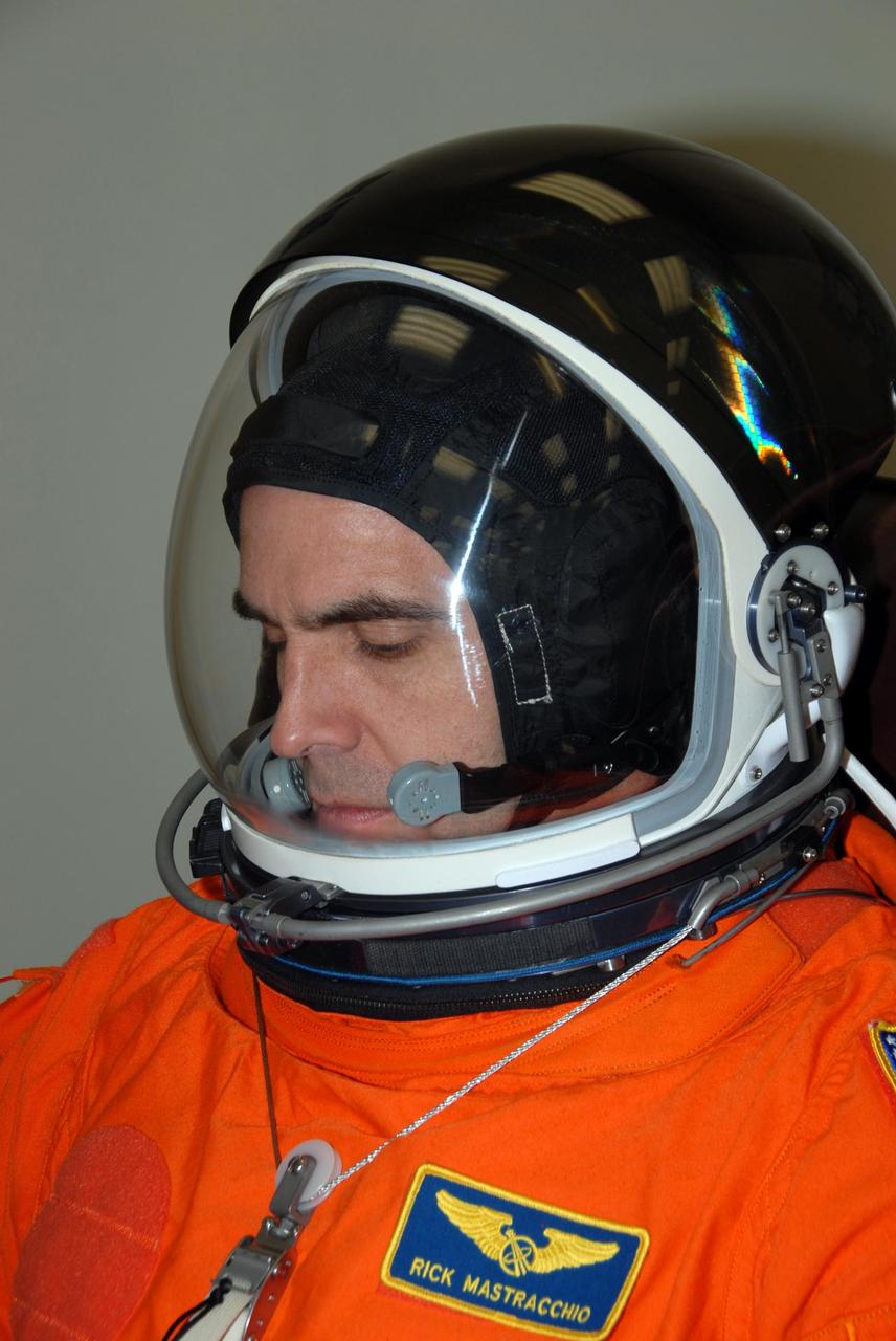 KENNEDY SPACE CENTER, Fla. -- STS-118 Mission Specialist Rick Mastracchio tests the fit of his helmet as well as the launch and entry suit. He and other crew members are at Kennedy for the Terminal Countdown Demonstration Test (TCDT) activities, a dress rehearsal for launch. TCDT activities include the M-113 training, payload familiarization, emergency egress training at the pad and a simulated launch countdown. The STS-118 payload aboard Space Shuttle Endeavour includes the S5 truss, a SPACEHAB module and external stowage platform 3. The mission is the 22nd flight to the International Space Station and is targeted for launch on Aug. 7. NASA/George Shelton