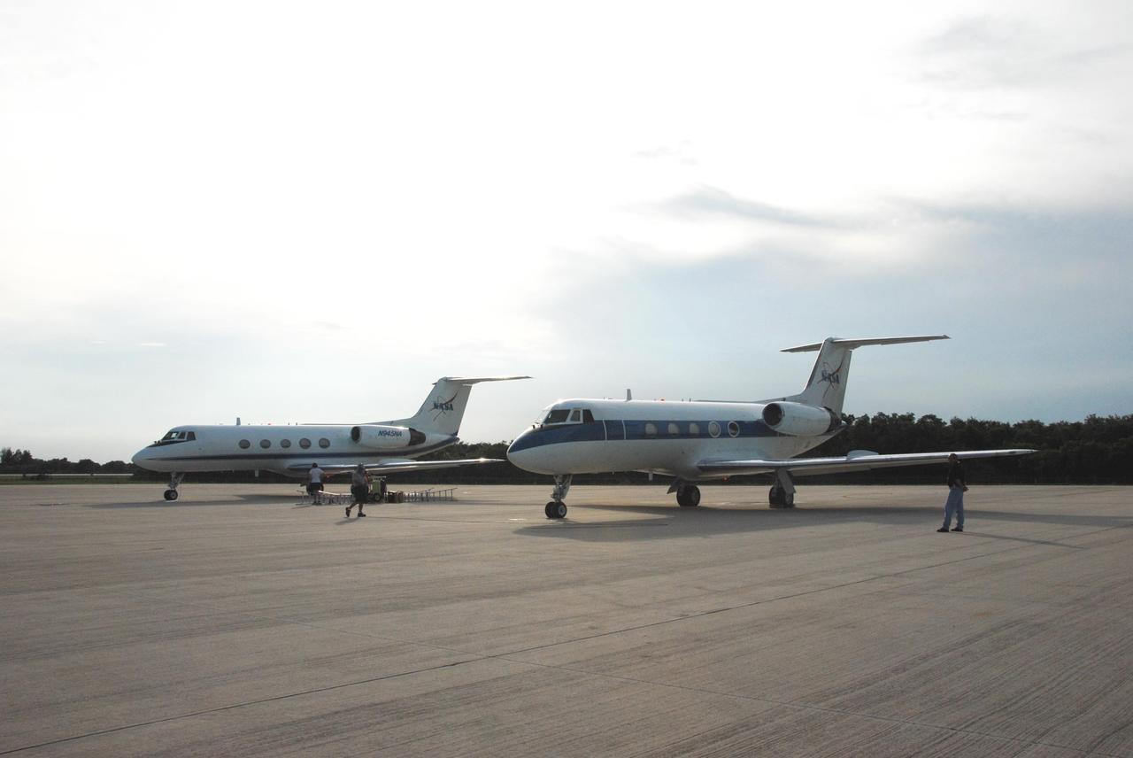 KENNEDY SPACE CENTER, Fla.  --  Two shuttle training aircraft, or STAs, wait to taxi onto the runway at the Shuttle Landing Facility.  STS-118 Commander Scott Kelly and Pilot Charlie Hobaugh are each piloting one of the STAs for landing practice.  The practice is part of Terminal Countdown Demonstration Test, or TCDT, activities that include a simulated launch countdown.  The STA is a Grumman American Aviation-built Gulf Stream II jet that was modified to simulate an orbiter's cockpit, motion and visual cues, and handling qualities. In flight, the STA duplicates the orbiter's atmospheric descent trajectory from approximately 35,000 feet altitude to landing on a runway. The STS-118 mission is the 22nd flight to the International Space Station and is targeted for launch on Aug. 7.  The mission payload aboard Space Shuttle Endeavour includes the S5 truss, a SPACEHAB module and external stowage platform 3.  NASA/George Shelton