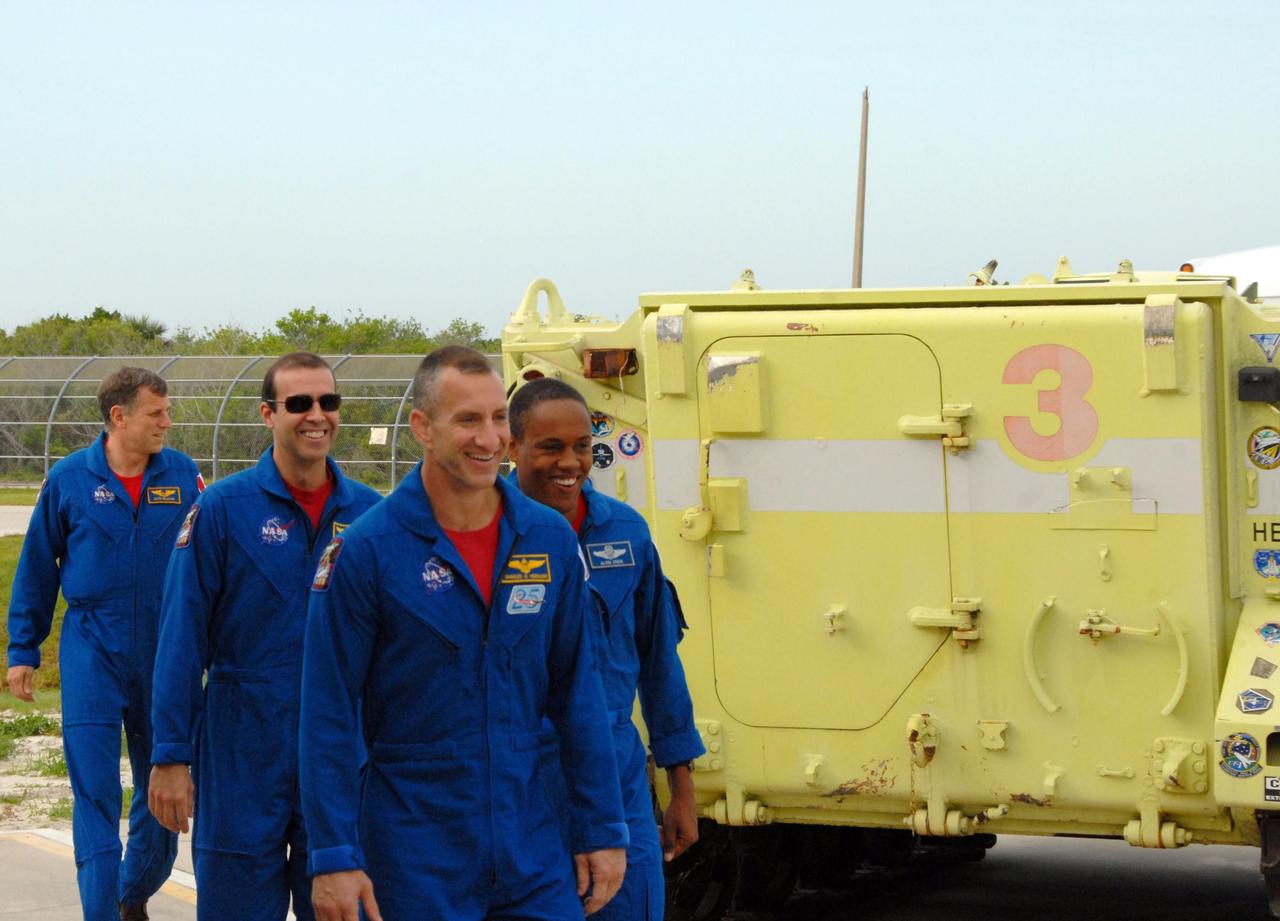 KENNEDY SPACE CENTER, Fla.  --    The STS-118 crew arrives on Launch Pad 39A for a media interview before the crew's morning training activities in the terminal countdown demonstration test, or TCDT.  From left are Mission Specialists Dave Williams and Rick Mastracchio, Pilot Charlie Hobaugh and Mission Specialist Alvin Drew.  Williams represents the Canadian Space Agency. TCDTactivities include M-113 training, payload familiarization, the emergency egress training at the pad and a simulated launch countdown.  The mission is the 22nd flight to the International Space Station and Space Shuttle Endeavour will carry a payload including the S5 truss, a SPACEHAB module and external stowage platform 3. STS-118 is targeted for launch on Aug. 7.  NASA/Ken Thornsley
