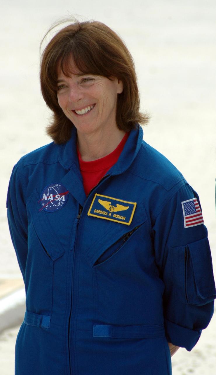 KENNEDY SPACE CENTER, Fla.  --  In the slidewire basket bunker area of Launch Pad 39A, STS-118 Mission Specialist Barbara R. Morgan reacts to the waiting press during a media interview before the crew's morning training activities in the terminal countdown demonstration test, or TCDT.  Morgan is a teacher-turned-astronaut whose association with NASA began more than 20 years ago.  TCDT activities include M-113 training, payload familiarization, the emergency egress training at the pad and a simulated launch countdown.  The mission is the 22nd flight to the International Space Station and Space Shuttle Endeavour will carry a payload including the S5 truss, a SPACEHAB module and external stowage platform 3. STS-118 is targeted for launch on Aug. 7.  Photo credit: NASA/Ken Thornsley