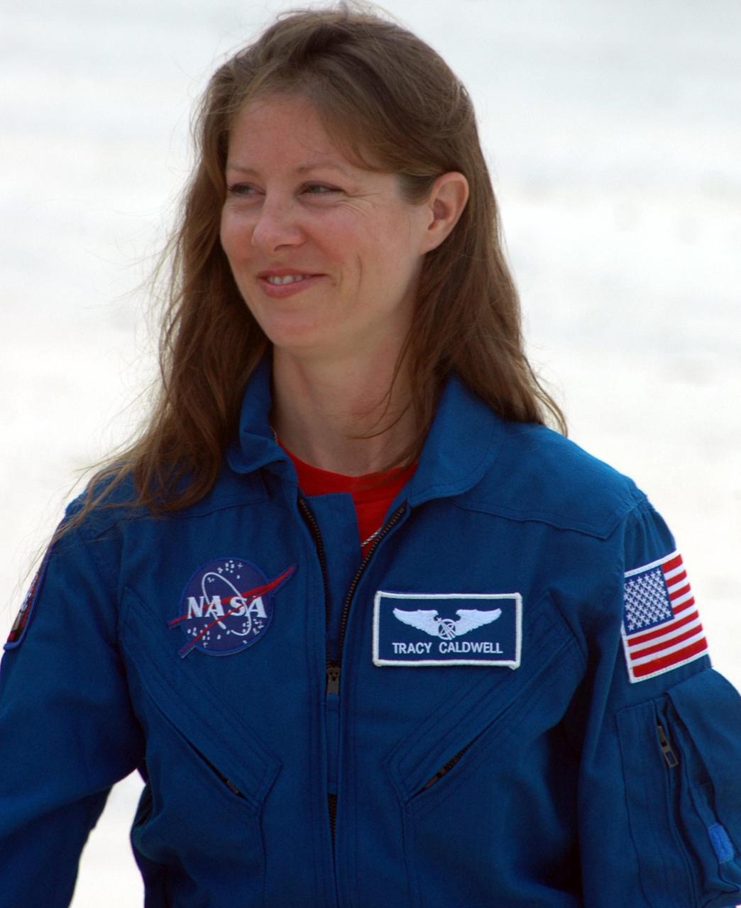 KENNEDY SPACE CENTER, Fla.  --  In the slidewire basket bunker area of Launch Pad 39A, STS-118 Mission Specialist Tracy Caldwell reacts to the waiting press during a media interview before the crew's morning training activities in the terminal countdown demonstration test, or TCDT. Those activities include M-113 training, payload familiarization, the emergency egress training at the pad and a simulated launch countdown.  The mission is the 22nd flight to the International Space Station and Space Shuttle Endeavour will carry a payload including the S5 truss, a SPACEHAB module and external stowage platform 3. STS-118 is targeted for launch on Aug. 7.  Photo credit: NASA/Ken Thornsley