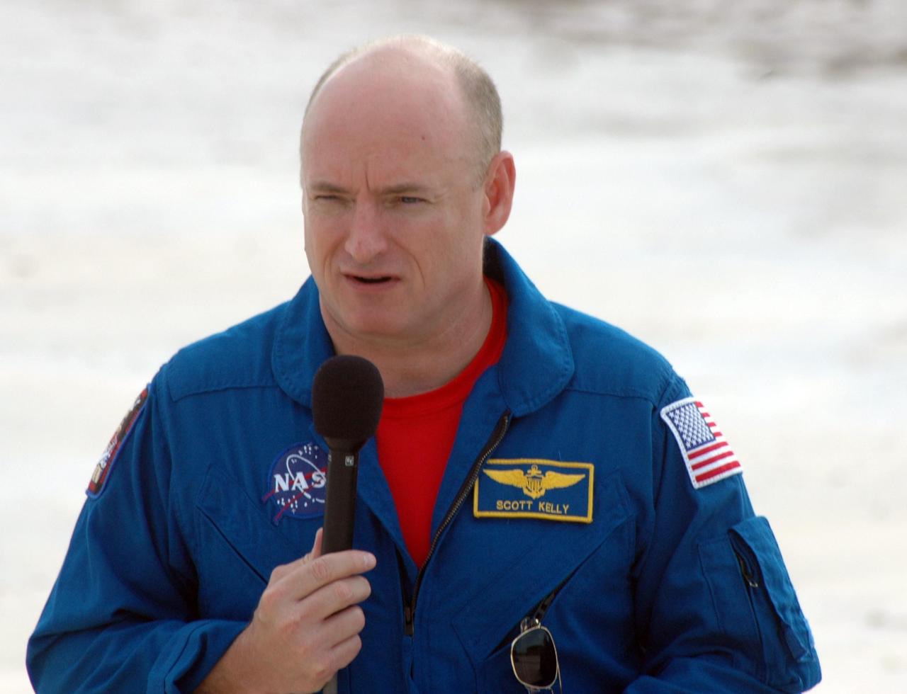 KENNEDY SPACE CENTER, Fla.  --  In the slidewire basket bunker area of Launch Pad 39A, STS-118 Commander Scott Kelly talks to the media at a press conference before the crew's morning training activities in the terminal countdown demonstration test, or TCDT. Those activities include M-113 training, payload familiarization, the emergency egress training at the pad and a simulated launch countdown.  The mission is the 22nd flight to the International Space Station and Space Shuttle Endeavour will carry a payload including the S5 truss, a SPACEHAB module and external stowage platform 3. STS-118 is targeted for launch on Aug. 7.  Photo credit: NASA/Ken Thornsley