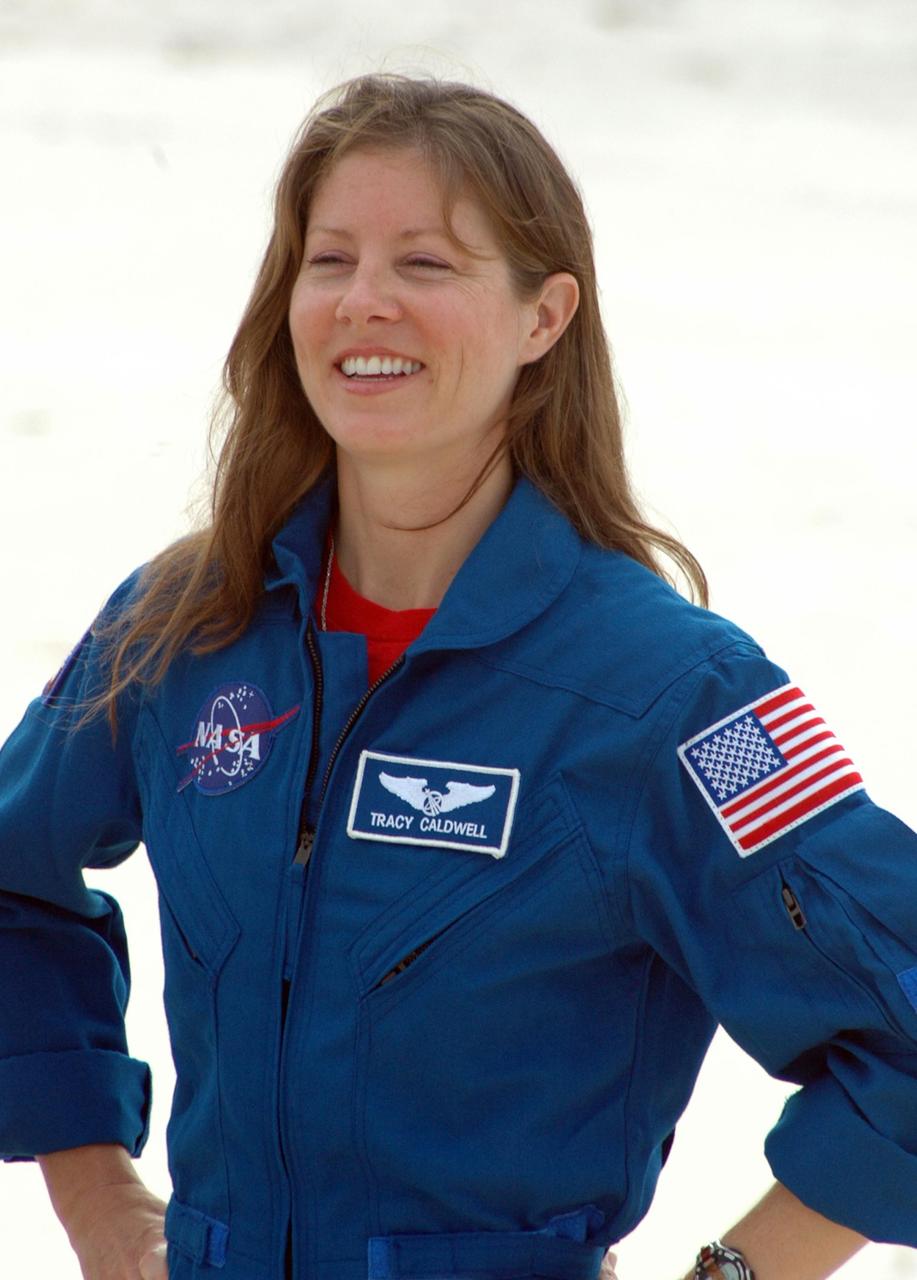 KENNEDY SPACE CENTER, Fla.  --  In the slidewire basket bunker area of Launch Pad 39A, STS-118 Mission Specialist Tracy Caldwell reacts to the waiting press during a media interview before the crew's morning training activities in the terminal countdown demonstration test, or TCDT. Those activities include M-113 training, payload familiarization, the emergency egress training at the pad and a simulated launch countdown.  The mission is the 22nd flight to the International Space Station and Space Shuttle Endeavour will carry a payload including the S5 truss, a SPACEHAB module and external stowage platform 3. STS-118 is targeted for launch on Aug. 7.  Photo credit: NASA/Ken Thornsley