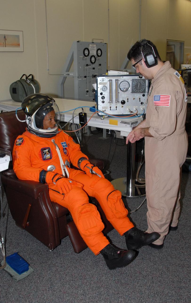 KENNEDY SPACE CENTER, Fla.  --  STS-118 Mission Specialist Alvin Drew completes suitup for the simulated launch countdown that concludes the terminal countdown demonstration test, or TCDT. The STS-118 crew has been at Kennedy for the TCDT activities that also include M-113 training, payload familiarization and emergency egress training at the pad.  The mission is the 22nd flight to the International Space Station and Space Shuttle Endeavour will carry a payload including the S5 truss, a SPACEHAB module and external stowage platform 3. STS-118 is targeted for launch on Aug. 7.  Photo credit: NASA/George Shelton