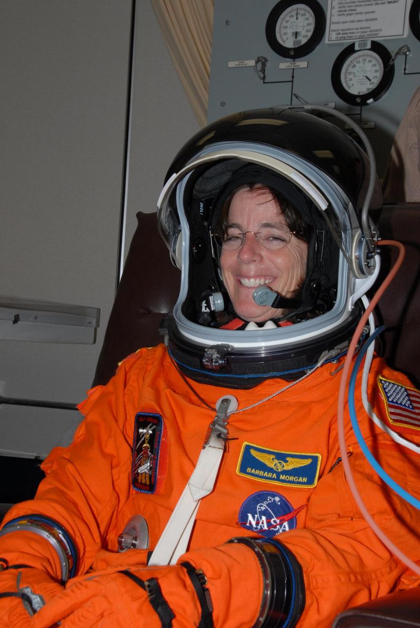 KENNEDY SPACE CENTER, Fla.  --  STS-118 Mission Specialist Barbara R. Morgan finishes suitup for the simulated launch countdown that concludes the terminal countdown demonstration test, or TCDT. Morgan joined NASA's Teacher in Space program in 1985 and was selected as an astronaut in 1998. The STS-118 crew has been at Kennedy for the TCDT activities that also include M-113 training, payload familiarization and emergency egress training at the pad.  The mission is the 22nd flight to the International Space Station and Space Shuttle Endeavour will carry a payload including the S5 truss, a SPACEHAB module and external stowage platform 3. STS-118 is targeted for launch on Aug. 7.  Photo credit: NASA/George Shelton