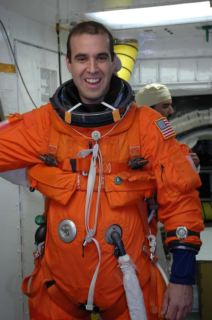 KENNEDY SPACE CENTER, Fla.  --In the White Room on Launch Pad 39A, STS-118 Mission Specialist Rick Mastracchio is eager to enter Space Shuttle Endeavour for a simulated launch countdown, the culmination of terminal countdown demonstration test activities.  The White Room is situated at the end of the orbiter access arm and provides entry into the orbiter. TCDT activities also include M-113 training, payload familiarization and emergency egress training at the pad.  The mission is the 22nd flight to the International Space Station and Space Shuttle Endeavour will carry a payload including the S5 truss, a SPACEHAB module and external stowage platform 3. STS-118 is targeted for launch on Aug. 7.  Photo credit: NASA/Amanda Diller