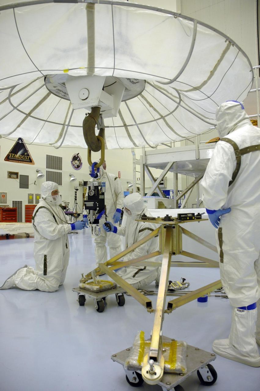 KENNEDY SPACE CENTER, Fla. -- In the Payload Hazardous Servicing Facility, workers prepare a crane that will be attached to the heat shield for the Phoenix Mars Lander spacecraft. The crane will lift and move the heat shield for installation over the lander within the cruise stage. Targeted for launch from Cape Canaveral Air Force Station on Aug. 3, Phoenix will land in icy soils near the north polar permanent ice cap of Mars and explore the history of the water in these soils and any associated rocks, while monitoring polar climate. Landing on Mars is planned in May 2008 on arctic ground where a mission currently in orbit, Mars Odyssey, has detected high concentrations of ice just beneath the top layer of soil. Photo credit: NASA/Troy Cryder