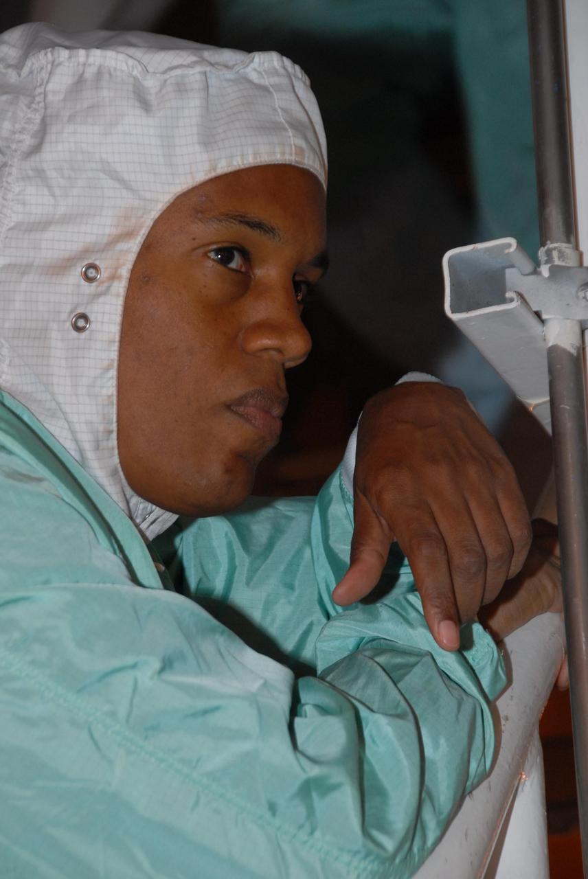 KENNEDY SPACE CENTER, Fla.  --  STS-118 Mission Specialist Alvin Drew gets a close look at the payloads installed in Space Shuttle Endeavour. The STS-118 crew has been at Kennedy for terminal countdown demonstration test activities that also include M-113 training, emergency egress training at the pad and a simulated launch countdown.  The mission is the 22nd flight to the International Space Station and Space Shuttle Endeavour will carry a payload including the S5 truss, a SPACEHAB module and external stowage platform 3. STS-118 is targeted for launch on Aug. 7.    Photo credit: NASA/George Shelton