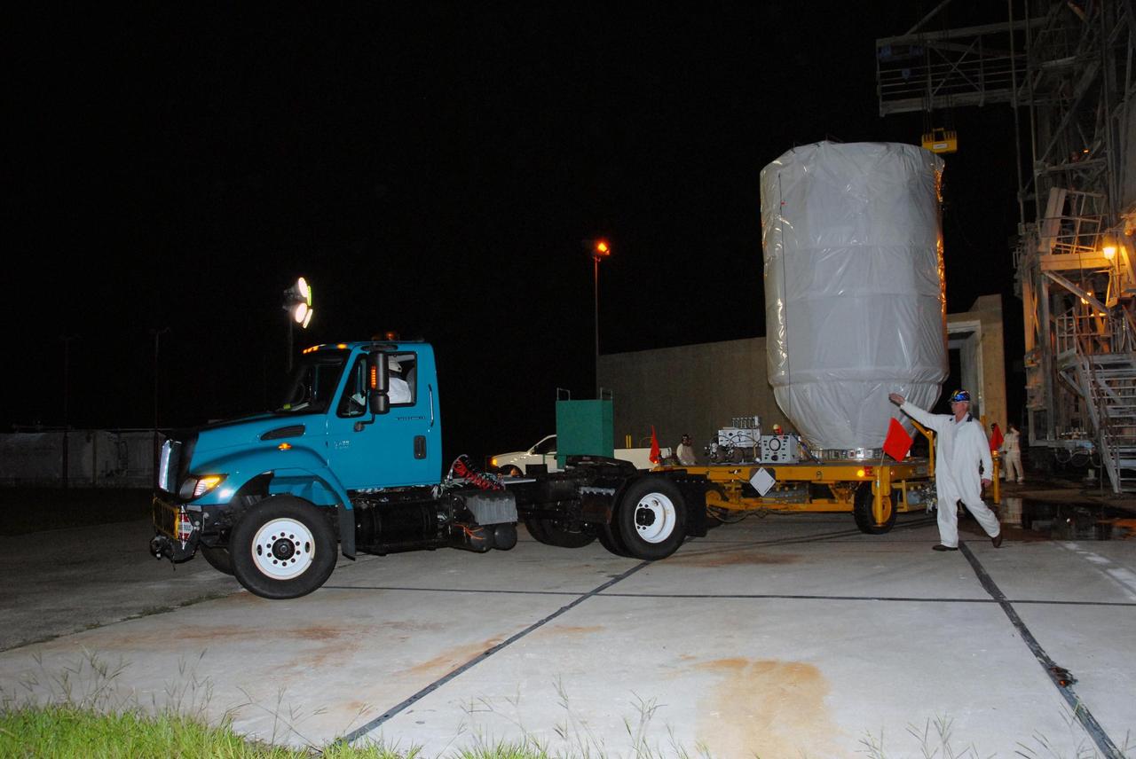 KENNEDY SPACE CENTER, FLA. — On Pad 17-B at Cape Canaveral Air Force Station, the Dawn spacecraft is safely secured on a transporter for its trip to Astrotech. Dawn is being returned to the Astrotech payload processing facility to await a new launch date. The launch opportunity extends from Sept. 7 to Oct. 15. Dawn is the ninth mission in NASA's Discovery Program. The spacecraft will be the first to orbit two planetary bodies, asteroid Vesta and dwarf planet Ceres, during a single mission. Vesta and Ceres lie in the asteroid belt between Mars and Jupiter. It is also NASA’s first purely scientific mission powered by three solar electric ion propulsion engines. NASA/George Shelton