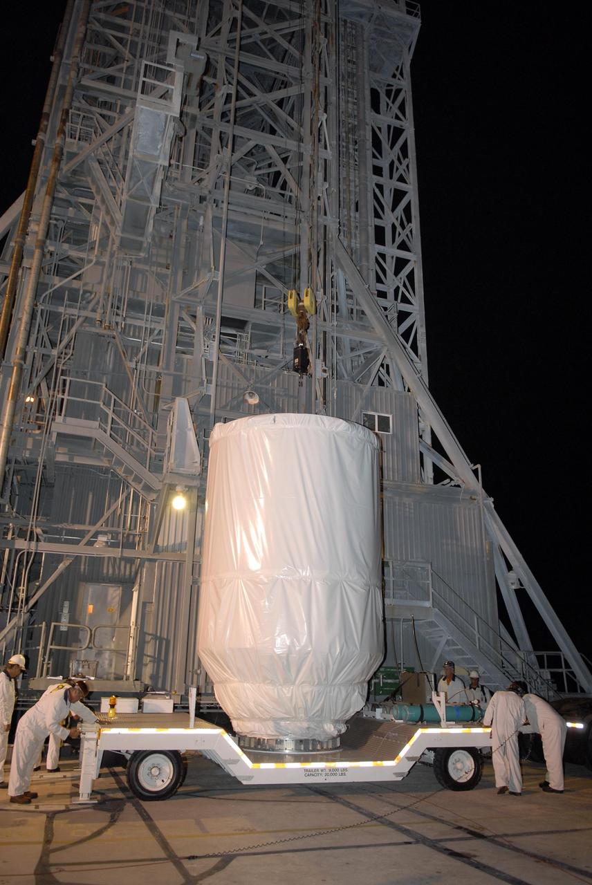 KENNEDY SPACE CENTER, FLA. — The Phoenix Mars Lander arrives at the mobile service tower on Launch Pad 17-A at Cape Canaveral Air Force Station. Launch of NASA's Phoenix Mars Lander is scheduled for Aug. 3. There are two instantaneous launch times, 5:35:18 and 6:11:24 a.m. EDT. Phoenix will land in icy soils near the north polar permanent ice cap of Mars and explore the history of the water in these soils and any associated rocks, while monitoring polar climate. Landing on Mars is planned in May 2008 on arctic ground where a mission currently in orbit, Mars Odyssey, has detected high concentrations of ice just beneath the top layer of soil. NASA/George Shelton