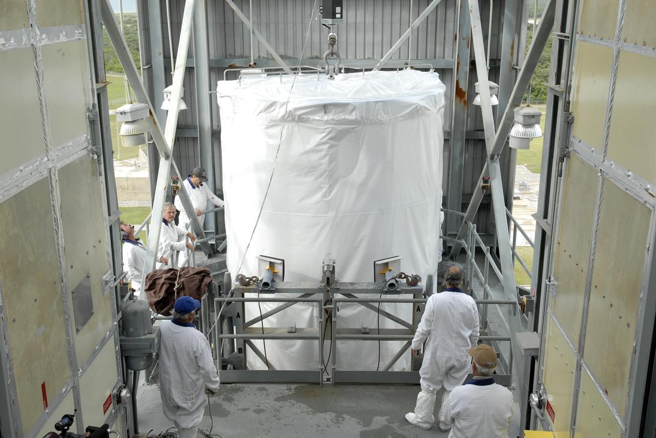 KENNEDY SPACE CENTER, FLA. —   The Phoenix Mars Lander is lifted into the upper level of the mobile service tower on Launch Pad 17-A at Cape Canaveral Air Force Station.  The lander will be mated to the Delta II launch vehicle.  Launch of NASA's Phoenix Mars Lander is scheduled for Aug. 3.  There are two instantaneous launch times, 5:35:18 and 6:11:24 a.m. EDT.  Phoenix will land in icy soils near the north polar permanent ice cap of Mars and explore the history of the water in these soils and any associated rocks, while monitoring polar climate. Landing on Mars is planned in May 2008 on arctic ground where a mission currently in orbit, Mars Odyssey, has detected high concentrations of ice just beneath the top layer of soil.   NASA/George Shelton