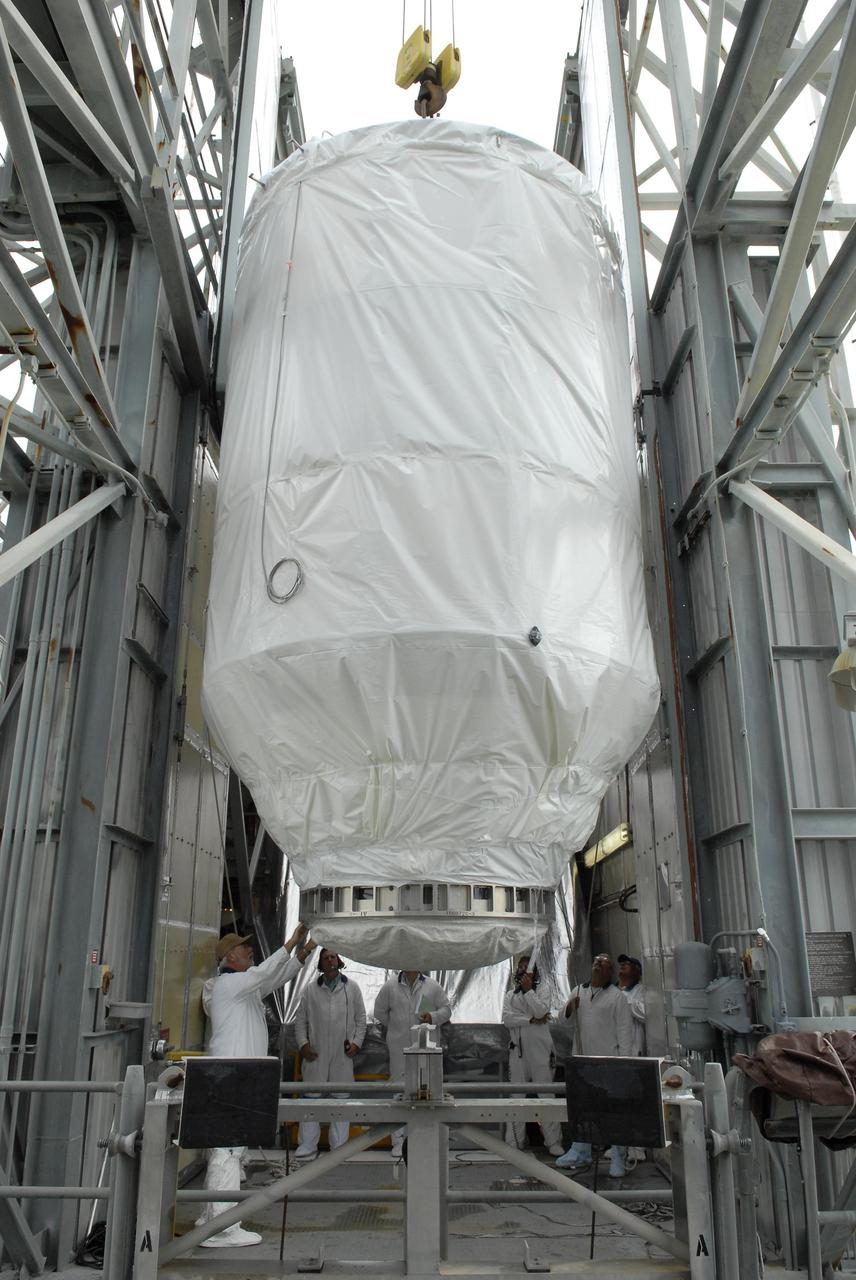 KENNEDY SPACE CENTER, FLA. — The Phoenix Mars Lander is moved inside the upper level of the mobile service tower on Launch Pad 17-A at Cape Canaveral Air Force Station. The lander will be mated to the Delta II launch vehicle. Launch of NASA's Phoenix Mars Lander is scheduled for Aug. 3. There are two instantaneous launch times, 5:35:18 and 6:11:24 a.m. EDT. Phoenix will land in icy soils near the north polar permanent ice cap of Mars and explore the history of the water in these soils and any associated rocks, while monitoring polar climate. Landing on Mars is planned in May 2008 on arctic ground where a mission currently in orbit, Mars Odyssey, has detected high concentrations of ice just beneath the top layer of soil. NASA/George Shelton