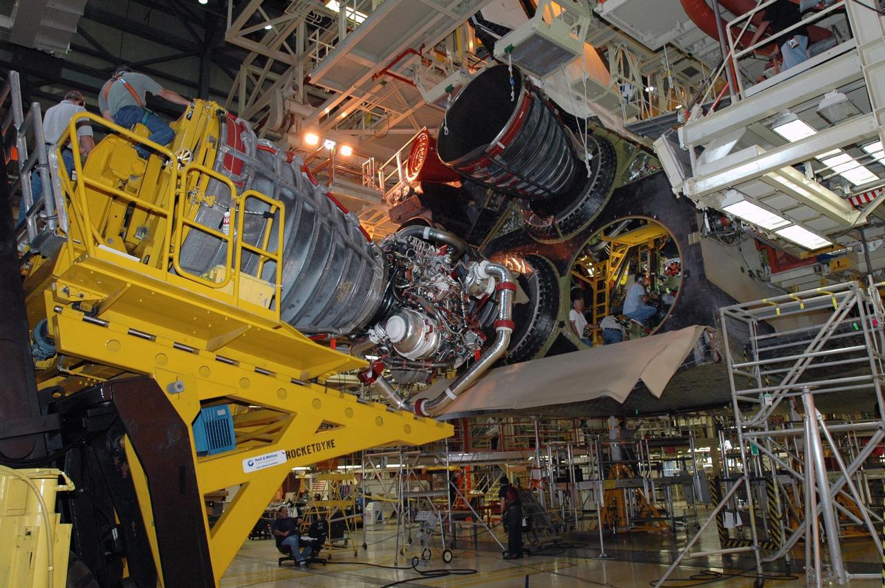 KENNEDY SPACE CENTER, FLA.  --   Inside Orbiter Processing Facility 3 at Kennedy Space Center, technicians prepare to install engine No. 3 to Discovery during processing for mission STS-120. Mission STS-120 will be the 23rd flight to the International Space Station. Space Shuttle Discovery will carry the U.S. Node 2. Launch is targeted for Oct. 20. NASA/Dimitri Gerondidakis