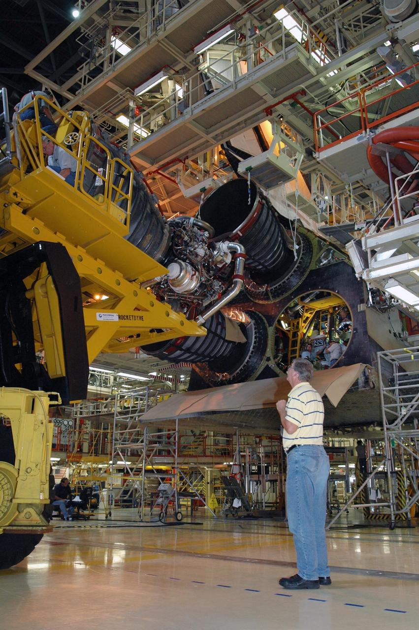KENNEDY SPACE CENTER, FLA.  --   Inside Orbiter Processing Facility 3 at Kennedy Space Center, technicians prepare to install engine No. 3 to Discovery during processing for mission STS-120. Mission STS-120 will be the 23rd flight to the International Space Station. Space Shuttle Discovery will carry the U.S. Node 2. Launch is targeted for Oct. 20. NASA/Dimitri Gerondidakis