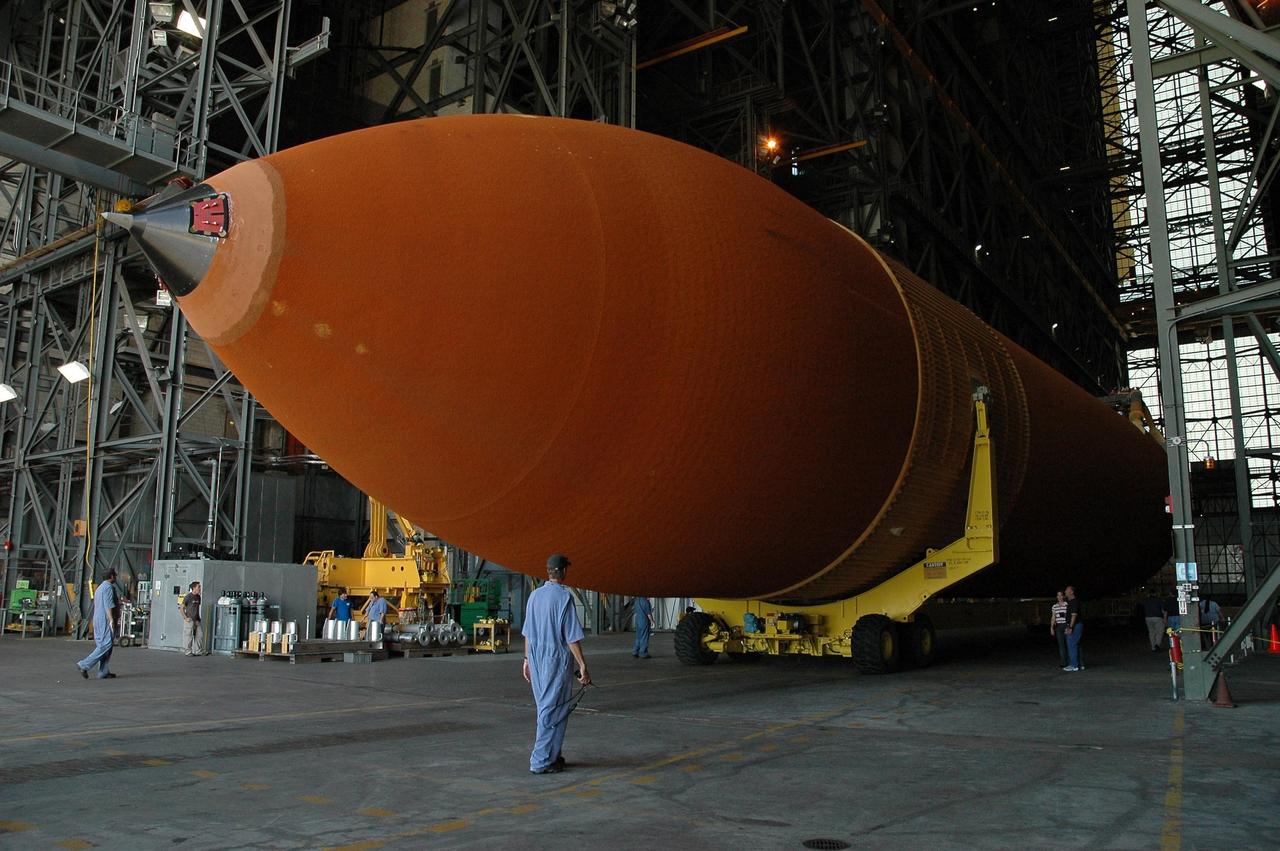 KENNEDY SPACE CENTER, FLA. --  External tank No. 120 comes to a stop in the transfer aisle of the Vehicle Assembly Building after its move from the Pegasus barge at the turn basin.  Next, the tank will be lifted into a checkout cell.   ET-120 will be used for launching Space Shuttle Discovery on mission STS-120 in October.  NASA/Amanda Diller
