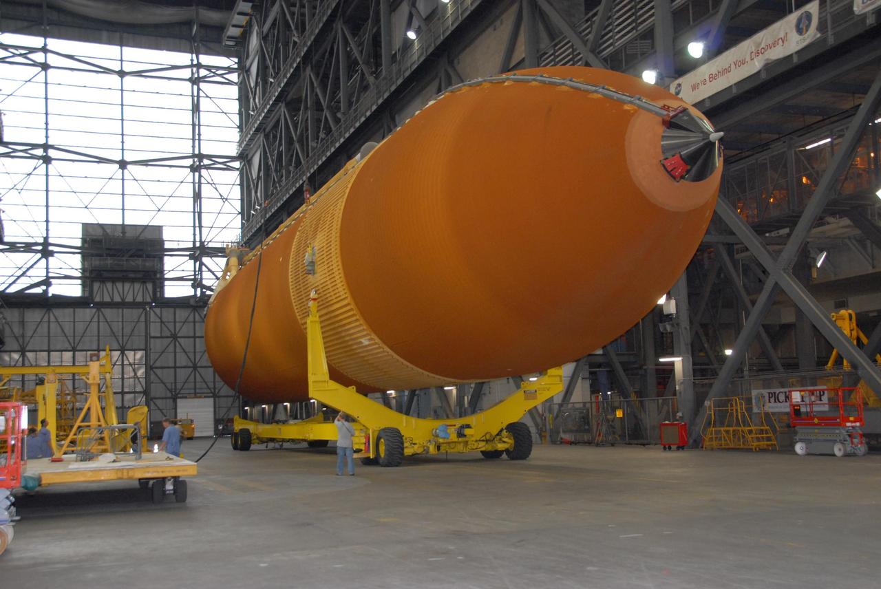 KENNEDY SPACE CENTER, FLA. --  In the transfer aisle of the Vehicle Assembly Building at KSC, external tank No. 120 is being fitted with a crane to raise and lift it into a checkout cell.  The tank will be used to launch Space Shuttle Discovery on mission STS-120 in October.  The mission is the 23rd to the International Space Station and will launch an Italian-built, U.S. multi-port module known as Harmony for the station.  Christened after a school contest, Harmony will provide attachment points for European and Japanese laboratory modules. NASA/George Shelton