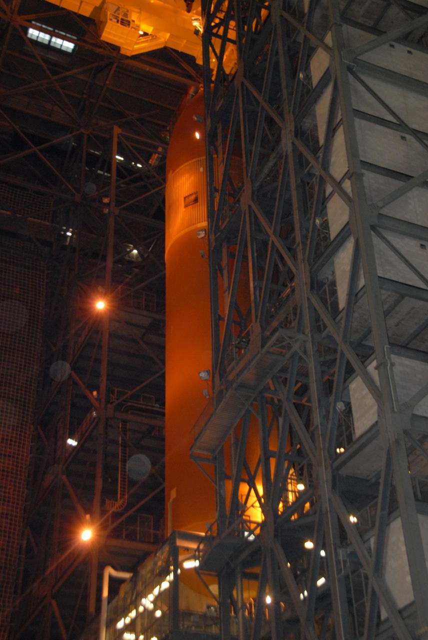 KENNEDY SPACE CENTER, FLA. --   In the Vehicle Assembly Building at KSC, a crane moves external tank No. 120 into a checkout cell.  The tank will be prepared for stacking with solid rocket boosters to launch Space Shuttle Discovery on mission STS-120 in October. The mission is the 23rd to the International Space Station and will launch an Italian-built, U.S. multi-port module known as Harmony for the station.  Christened after a school contest, Harmony will provide attachment points for European and Japanese laboratory modules. NASA/George Shelton