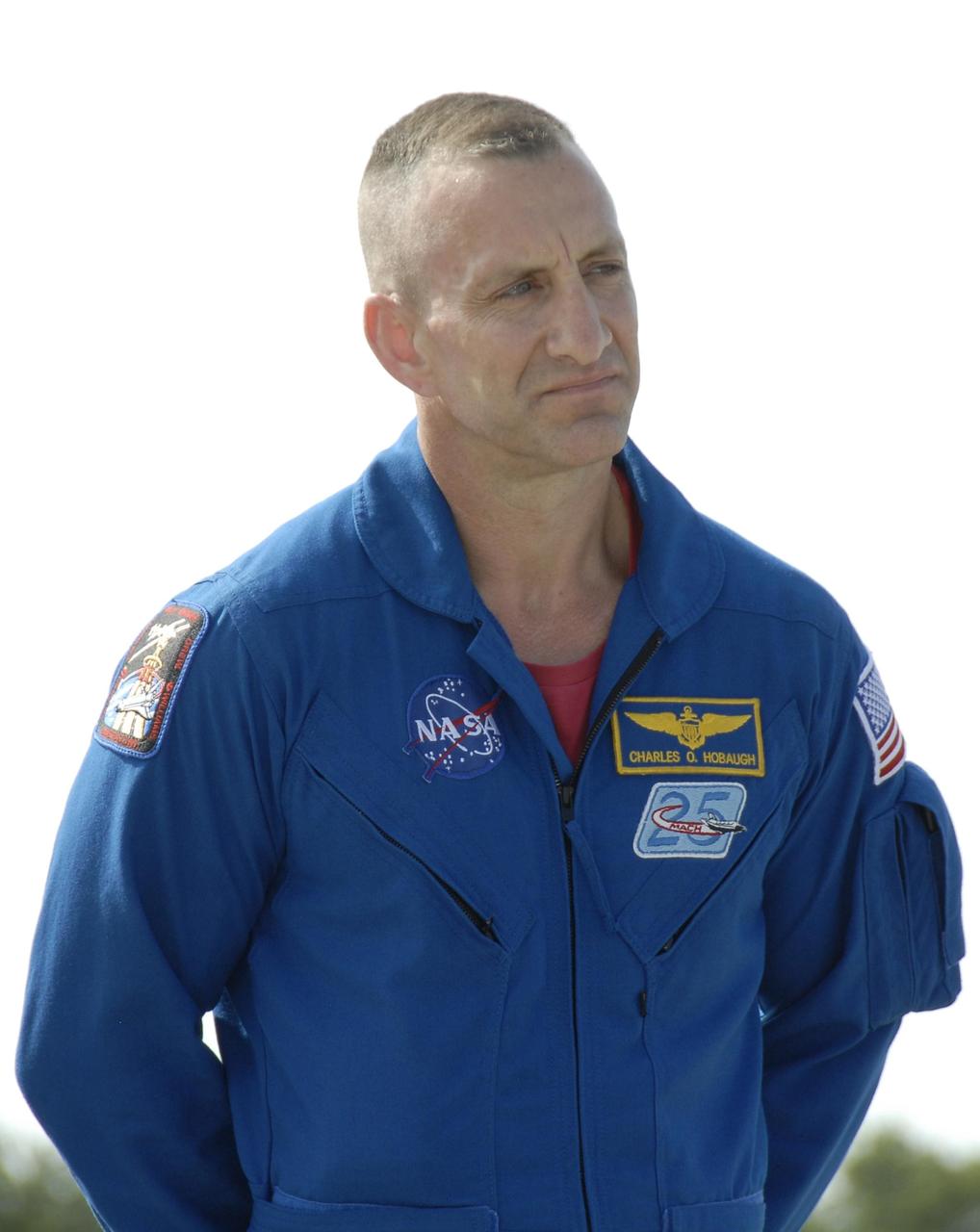 KENNEDY SPACE CENTER, FLA. --   The STS-118 crew arrives at Kennedy Space Center's Shuttle Landing Facility to prepare for launch on Aug. 8 aboard Space Shuttle Endeavour. Seen here is Pilot Charlie Hobaugh. Endeavour's STS-118 mission is the 22nd shuttle flight to the International Space Station. It will continue space station construction by delivering a third starboard truss segment, S5.  Other payloads include the SPACEHAB module, making its last voyage, and the external stowage platform 3 with a control moment gyroscope on it. The flight will include at least three spacewalks. The crew will also debut a new system that enables docked shuttles to draw electrical power from the station to extend visits to the outpost.  NASA/Kim Shiflett
